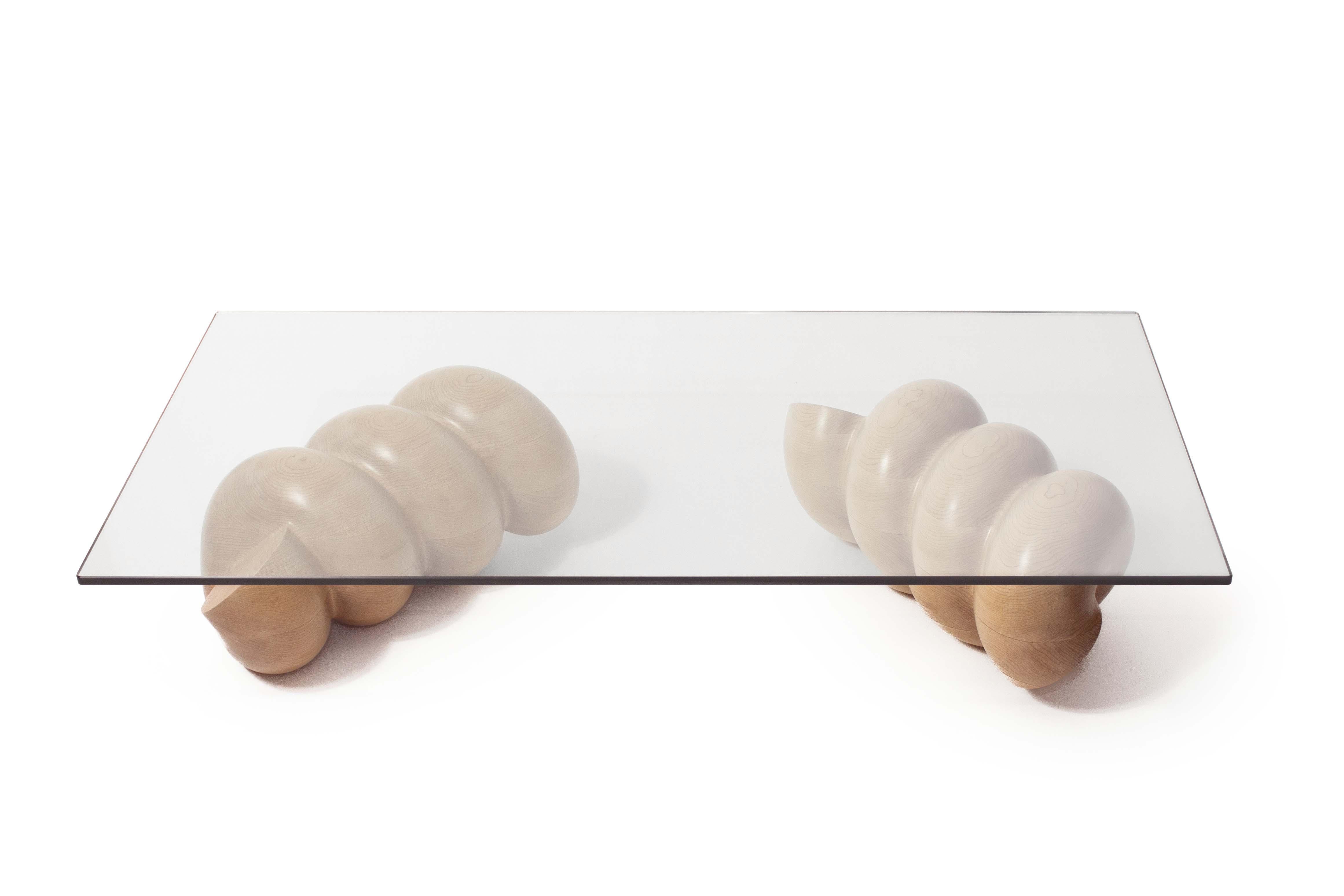 The Cavatappi coffee table is part of the Al Dente collection by furniture designer and artist, Caleb Ferris. Its whimsical base recalls the shape of pasta, while the material choices keep it firmly grounded and sophisticated. 

The coffee table