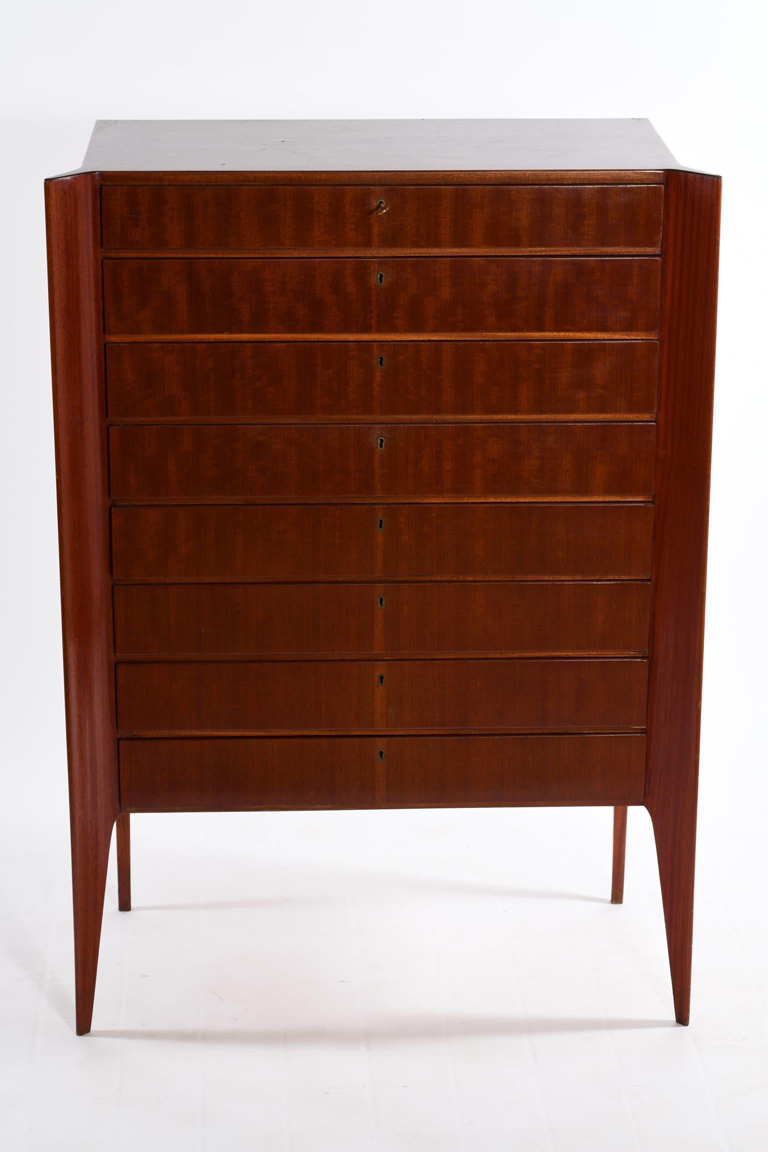 Chest of drawers with eight drawers, the front legs emerge out of the body of the furniture like fins, becoming thinner downwards.
Cavatorta Italia 1950s. Mid-Century Modern.
 