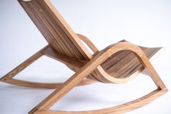 'Caverna' contemporary wooden rocking chair by Brazilian Studio Knót Artesanal