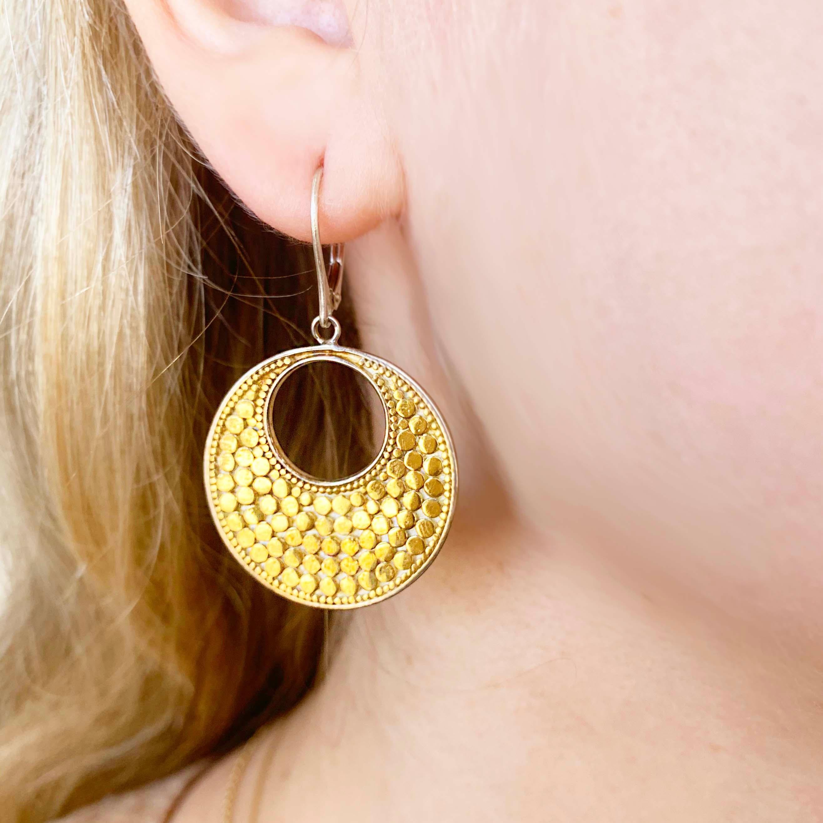 These precious earrings are a MUST BUY!  These earrings were handmade with 18 karat yellow gold that have been bonded with a sterling silver disk. The 18 kt yellow gold round earrings have a sterling silver back and sterling silver kidney wires.