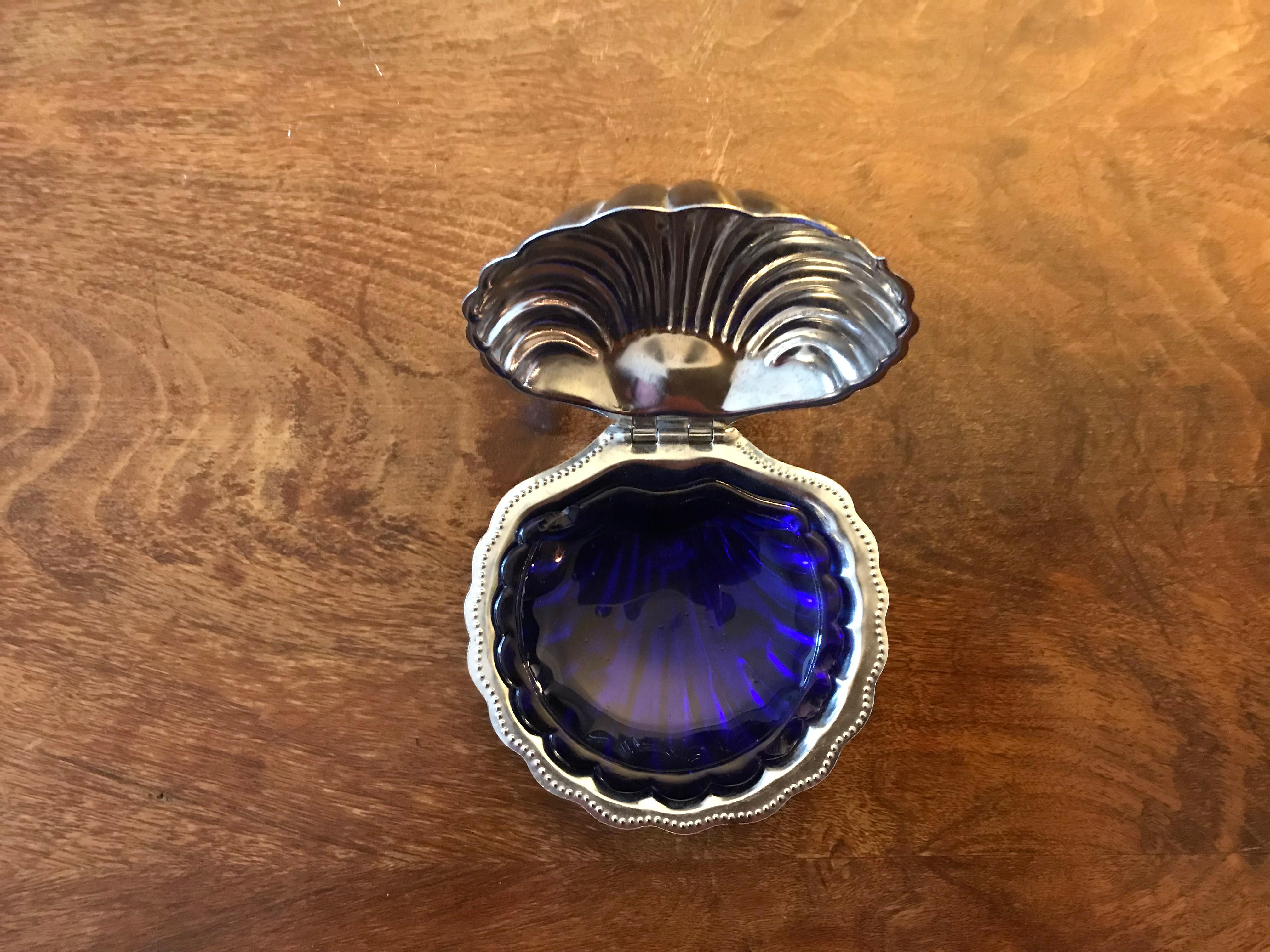 Caviar set including 2 shell shape jars in opaline blue and white glasses. France, circa 1950s.

 