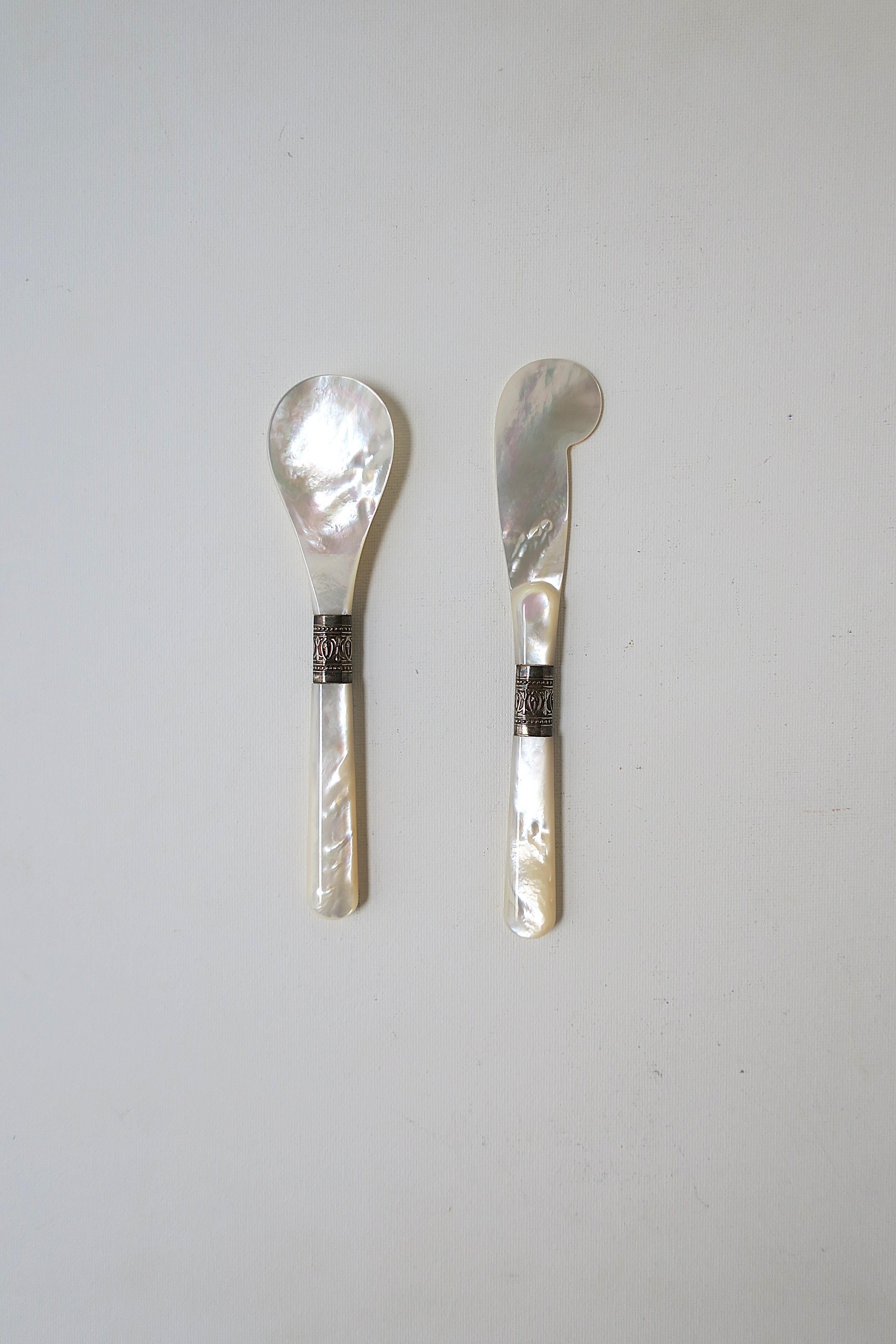A beautiful Mother of Pearl caviar spoon and knife spreader set (2 pieces.) A great set for caviar or other gourmet cuisine. A beautiful set with some nice weight to each piece. Set may also make a nice gift.  