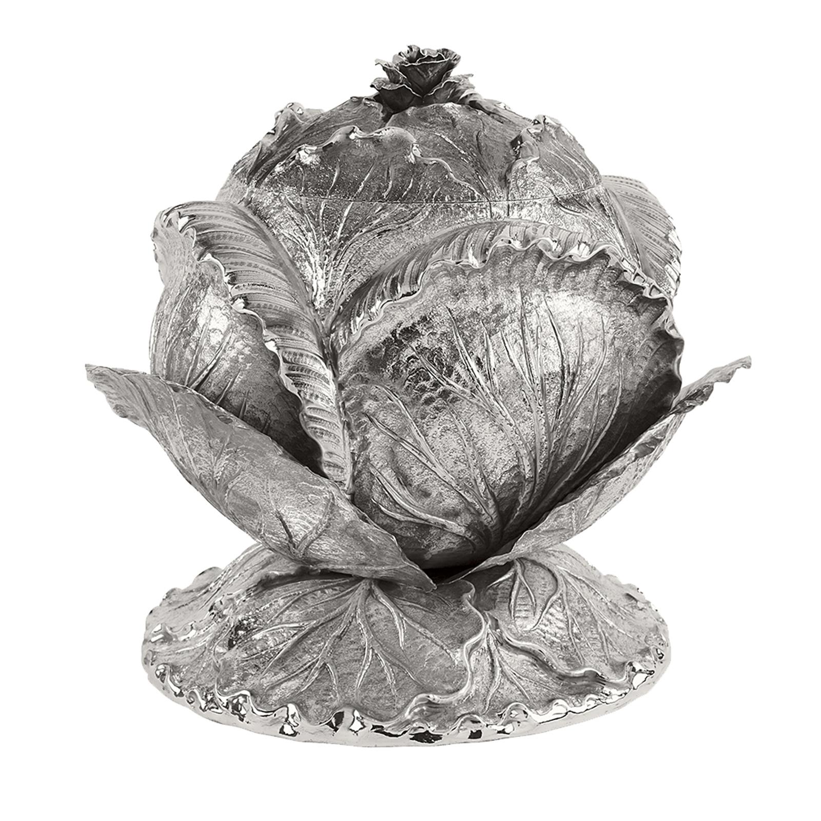 This sumptuous soup terrine is made entirely in silver in the shape of a cabbage, rendered in all its vivid detail. Masterful craftsmanship and a Classic style make this piece a timeless object of functional decor that will instantly enrich any