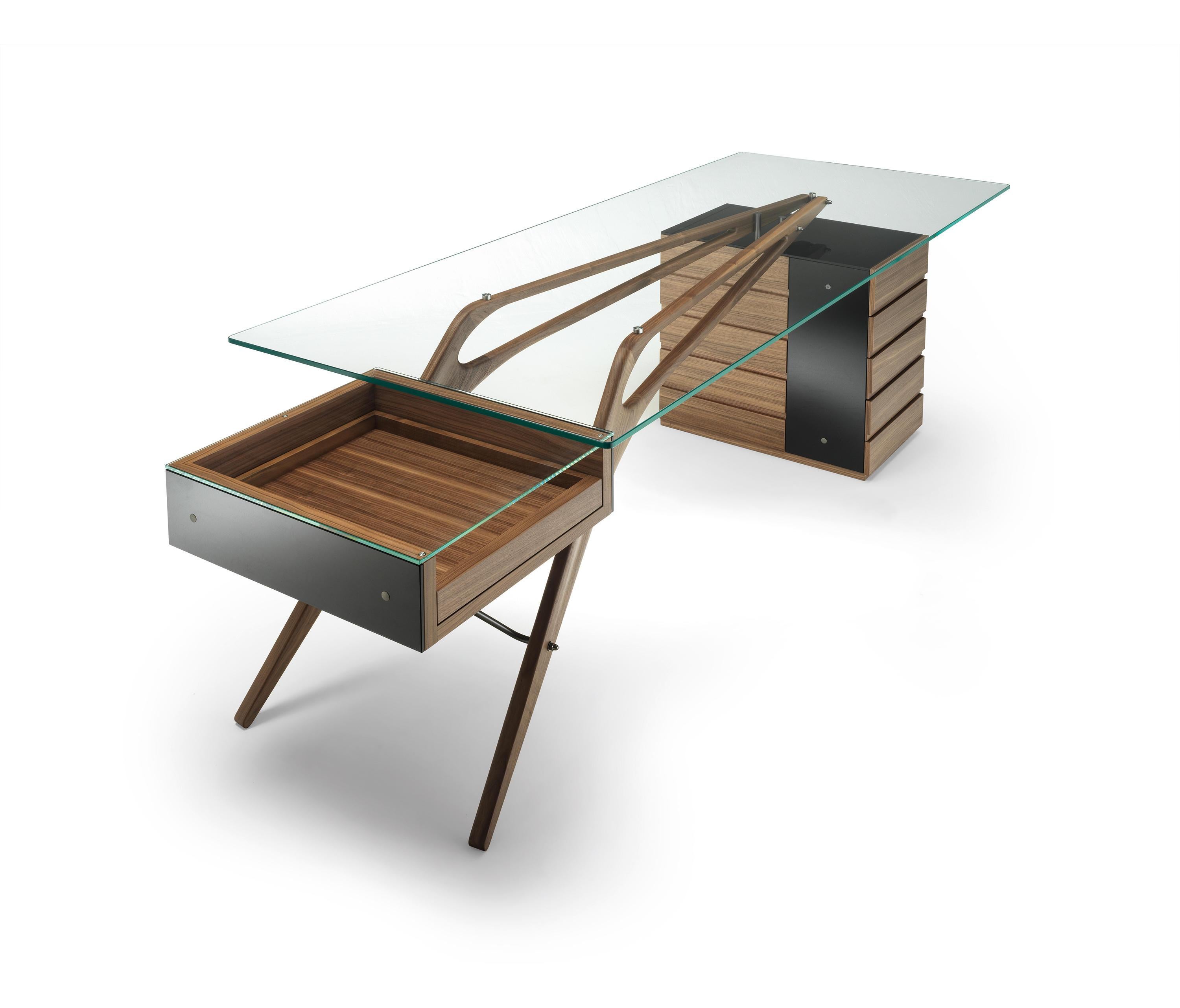 Designed by Carlo Mollino in 1949 for Zanotta, the Cavour Desk forms part of an eccentric yet elegant collection for one of the leaders in Italian industrial design. All soaring lines and alpine finishes, this desk embodies many of the tenets of