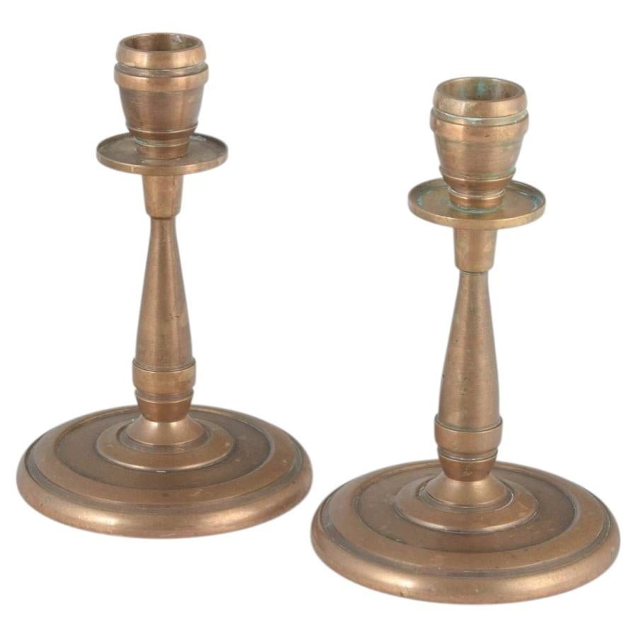CAWA, Denmark. Pair of brass candlesticks in Art Deco style, 1940s. For Sale