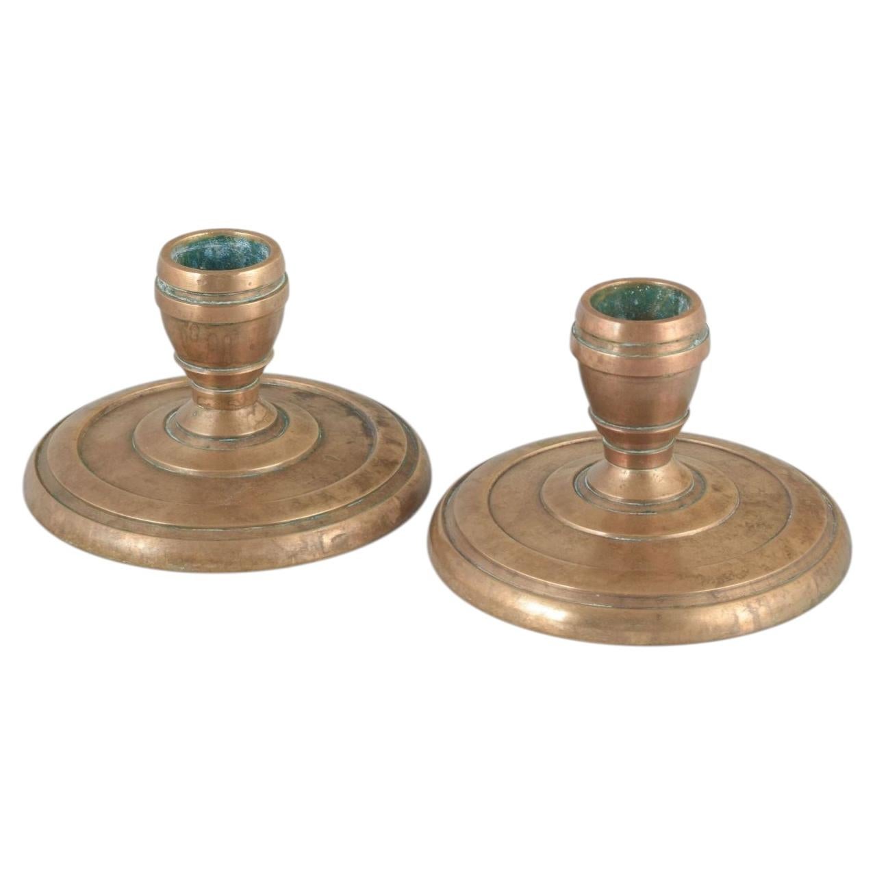 CAWA, Denmark. Pair of solid brass candlesticks with circular base. For Sale