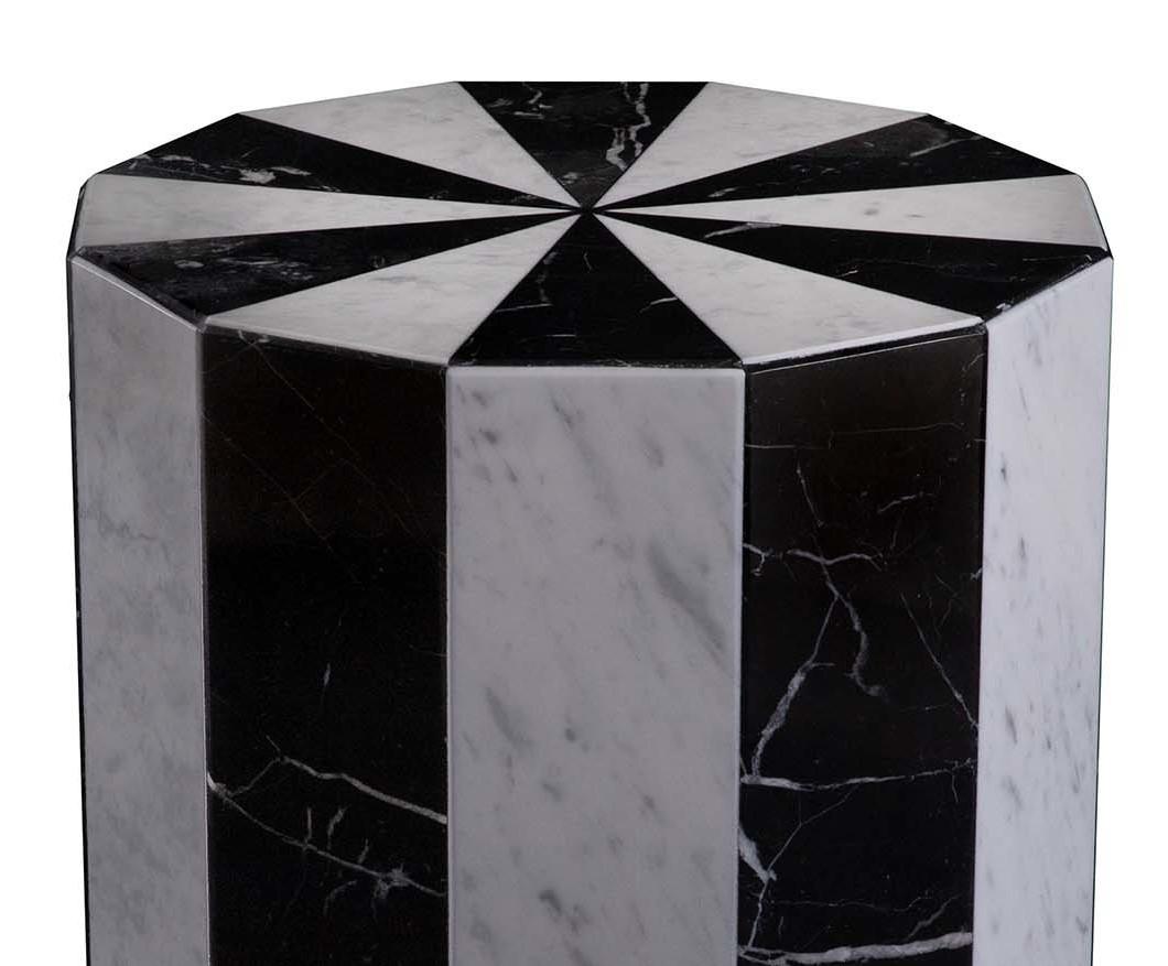 This marble stool begins with a reflection on the natural strength of marble. It brings new and unseen aesthetics to the material, with a lively shape and a dynamic allure. The piece is made of white Carrara and black Marquina marble. Variations of