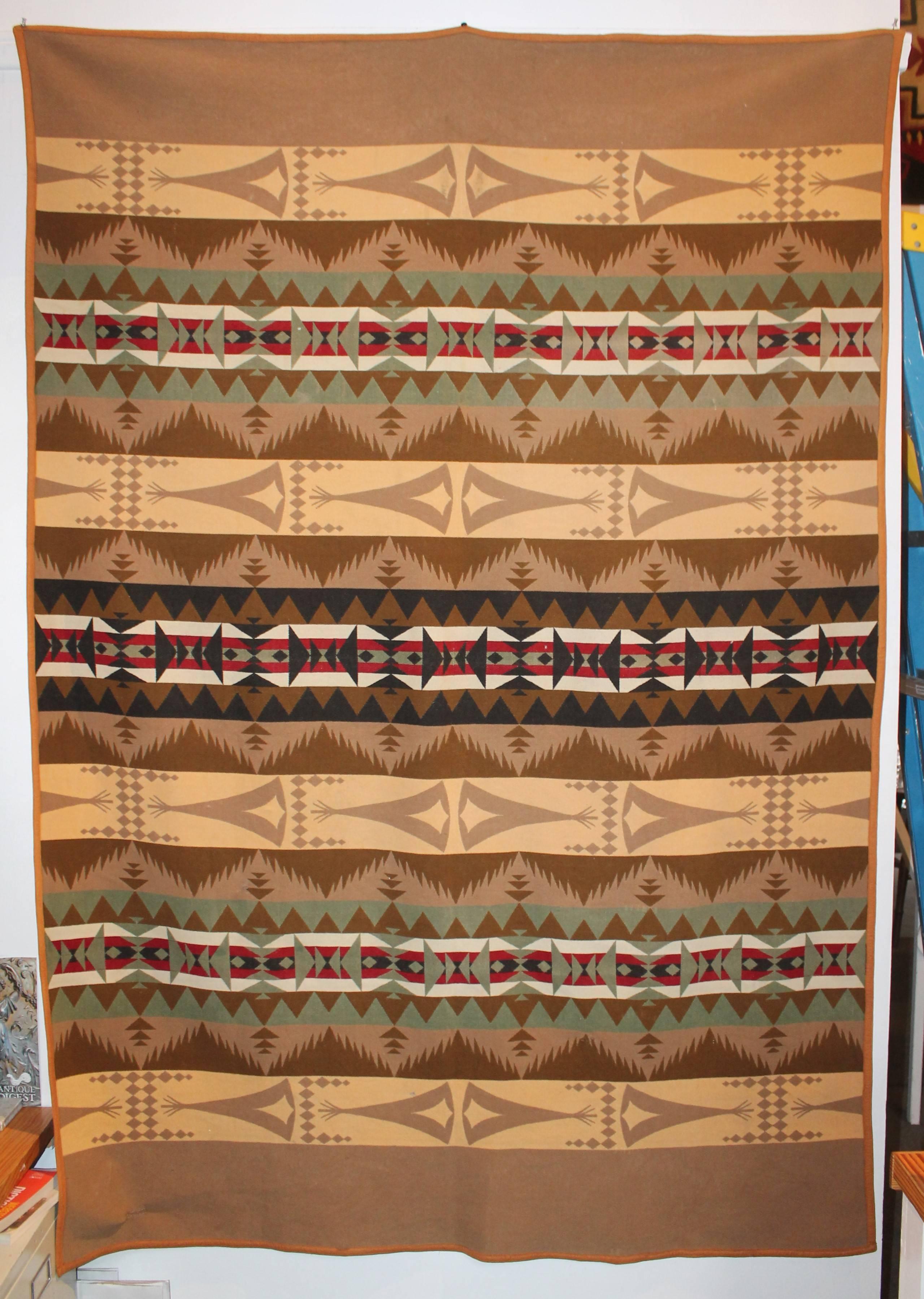 Pendleton Indian design teepee camp blanket. This fine and most unusual camp blanket is in fine condition with minor wear on edge.