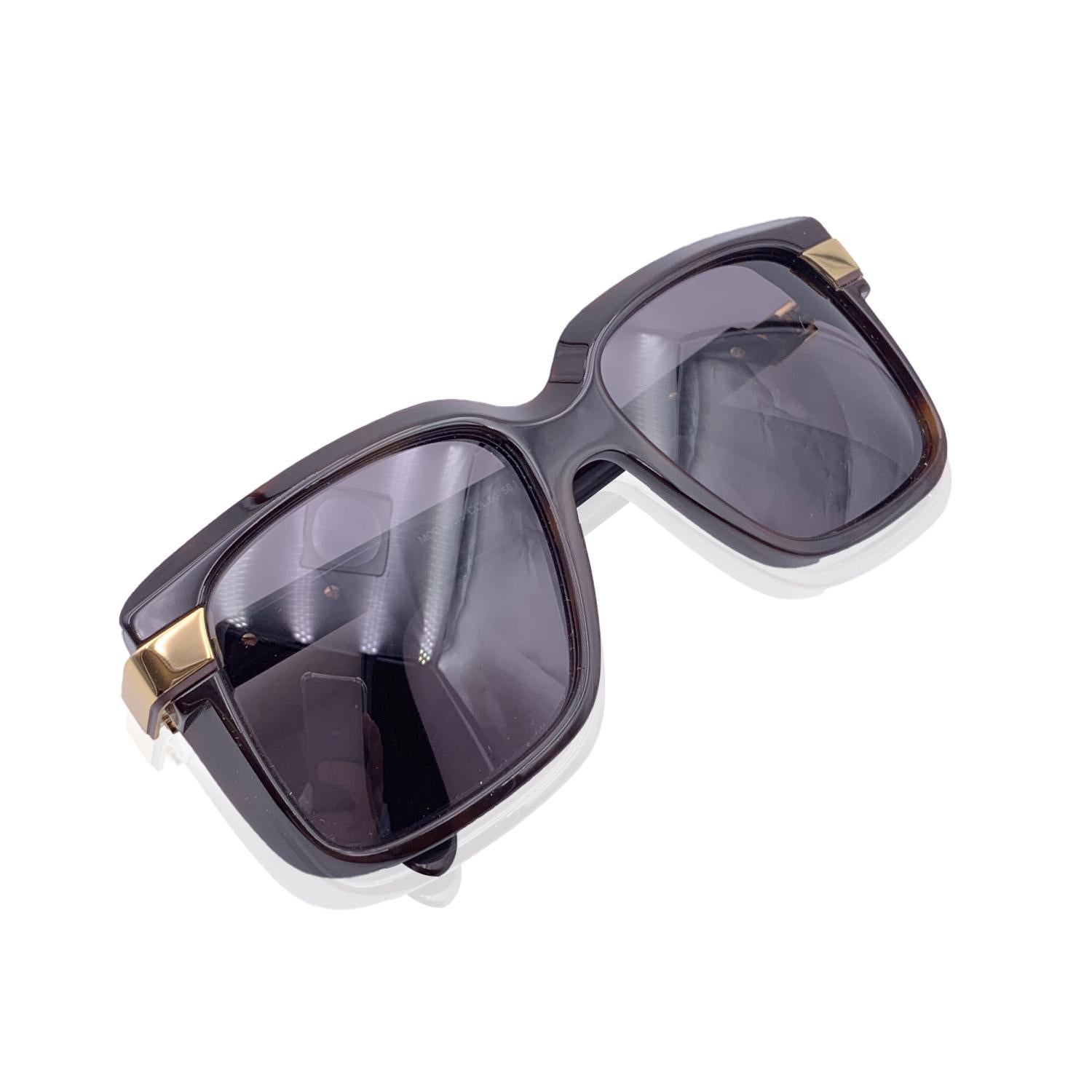 Beautiful sunglasses by Cazal, mod. 680/3 Col. 80. Dark brown acetate frame with gold metal accents on temples. Cazal logo on temples. Grey 100% UV protection lenses. Made in Germany.

Details

MATERIAL: Acetate

COLOR: Brown

MODEL: Mod. 680/3 Col.