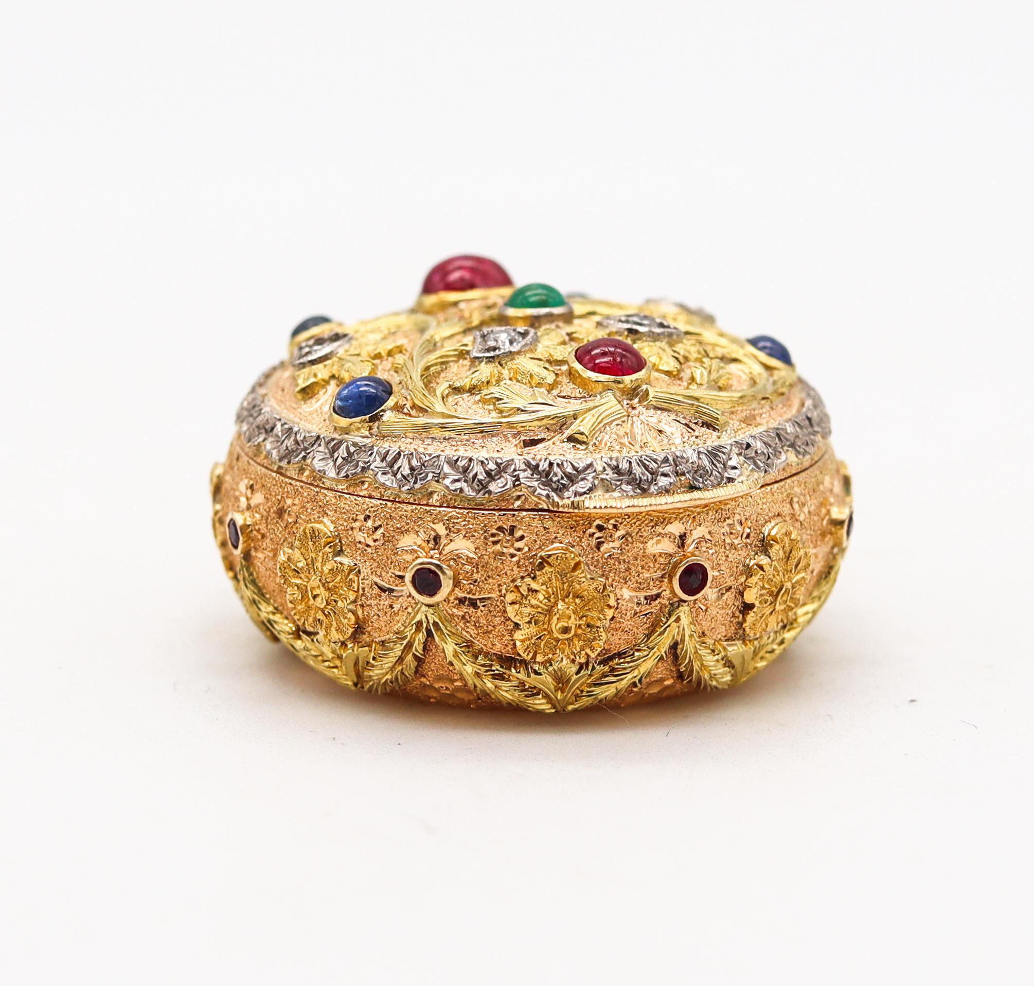 Beautiful gem set pill box designed by Cazzaniga.

Gorgeous luxurious and colorful piece, created in Roma Italy by the house of Cazzaniga, back in the 1950's. This stunning round bombe pill box has been crafted in the high rococo style with