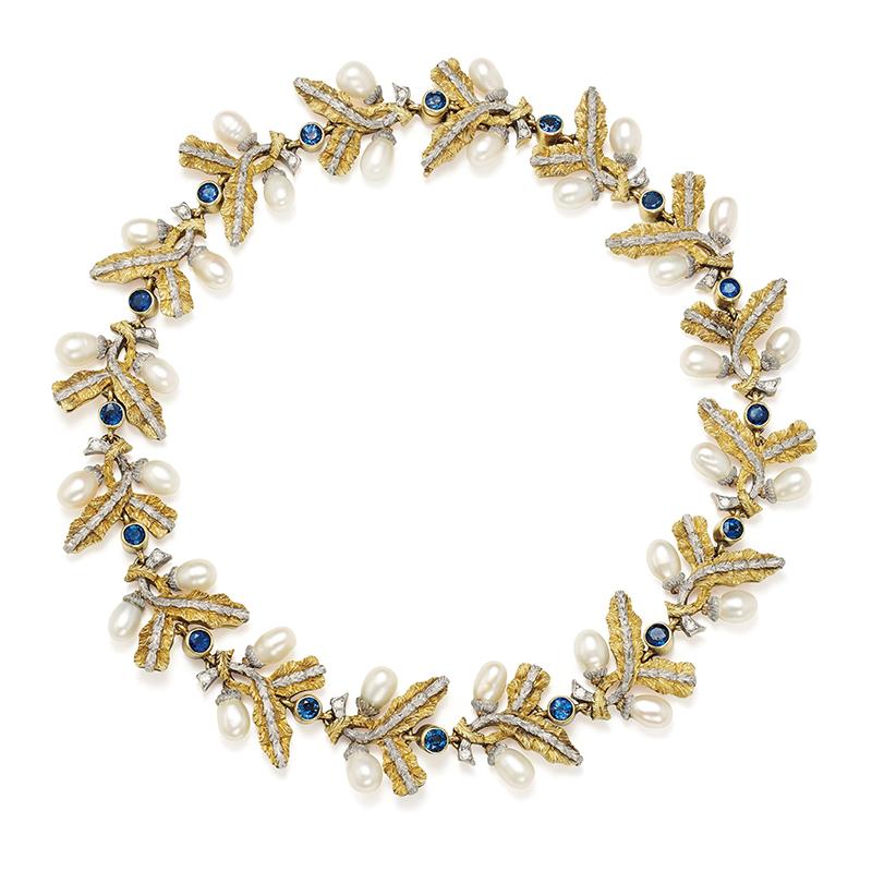 A refined necklace of folate design by historical Roman jeweler Cazzaniga, presenting pearls and sapphires on a mixed 18kt yellow and gold mounting. Italy, circa 1965.