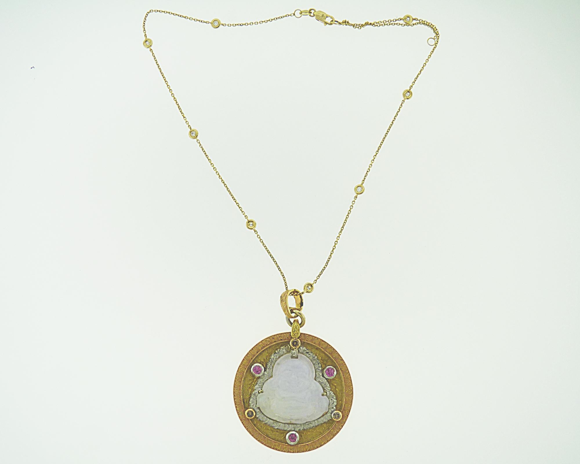 A unique Cazzaniga Pendant in 18K Yellow Gold with Diamonds, Ruby and Lavender Jade. 
Weight of the pendant is 30.10 grams. Embellished with 0.19 carat melee white diamonds. 
0.49 cart ruby and 22.50 carat lavender jade. 
Chain is not included.
