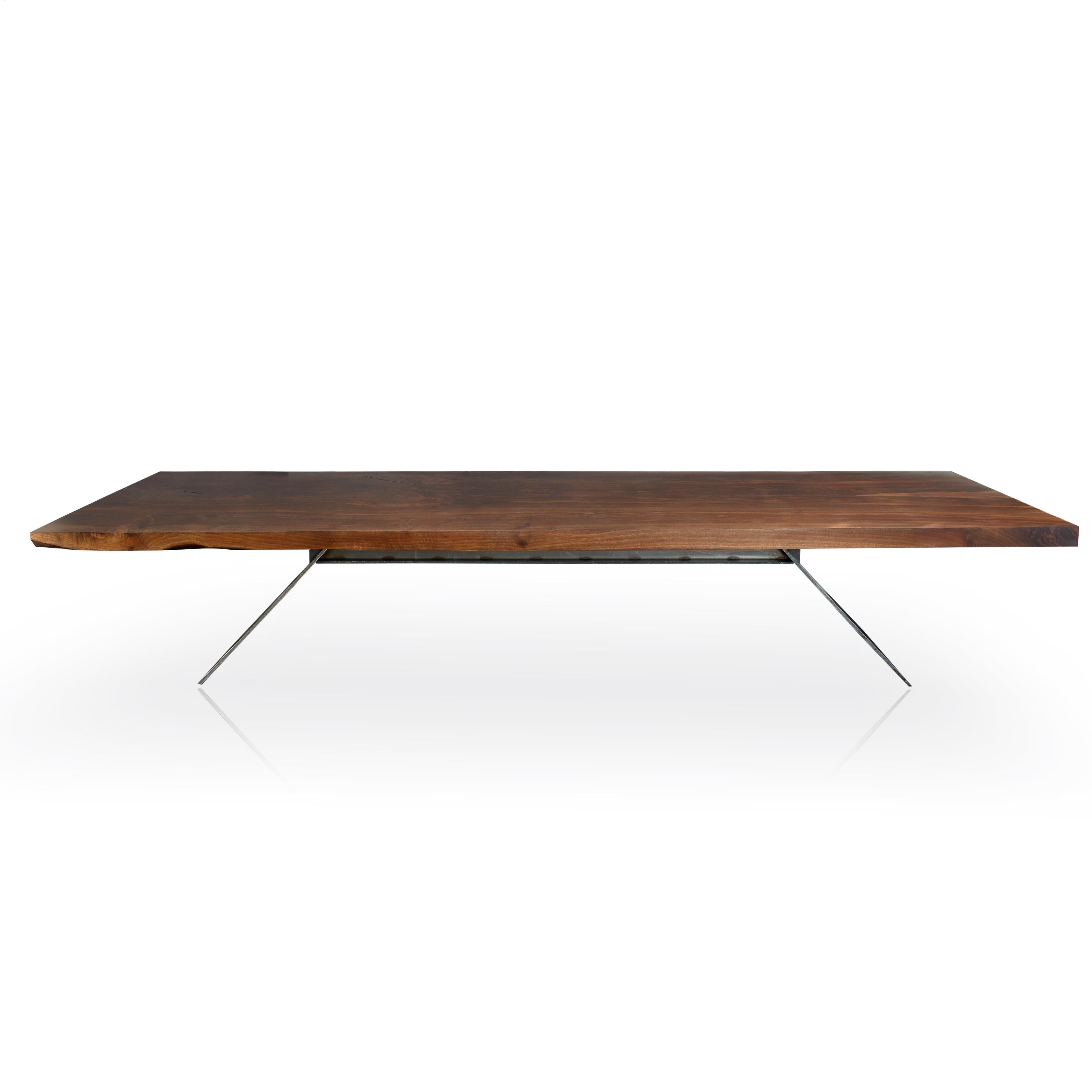 Modelling after the CB acrylic table, this is our metal version supporting a 13-foot long and 50-inch single piece of Claro Walnut.

The process began flattening the single Walnut piece by long board sander, making sure to retain thickness on the