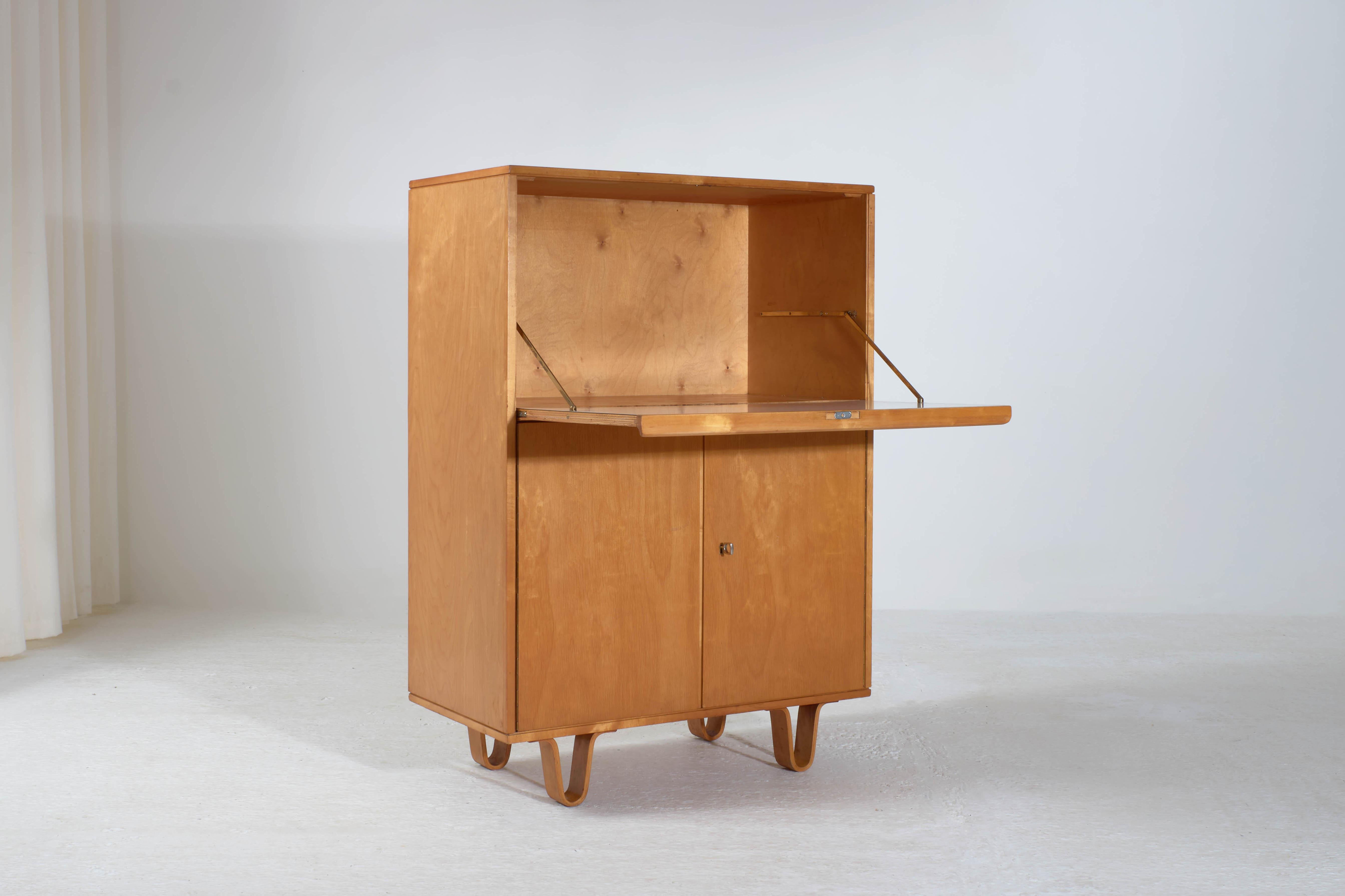 CB07 Bureau cabinet by Cees Braakman for Pastoe made in The Netherlands Circa, 1950s. A design classic from the early days of birch plywood, the steam bent legs are the signature of this series. Condition is good with signs of wear consistent with