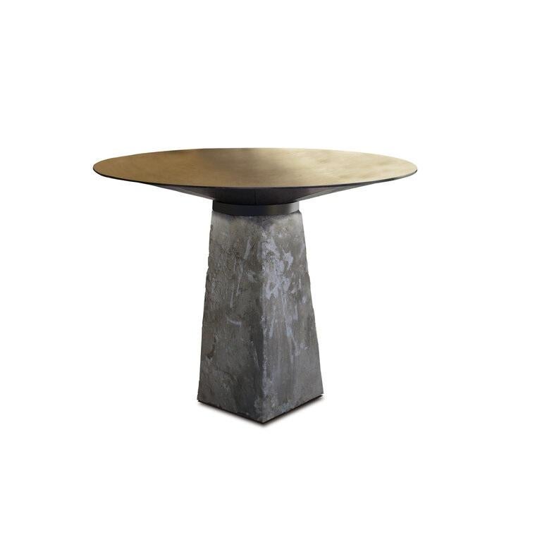 CBS_1 table by Jan Garncarek.
Limited Edition of 8.
Dimensions: D 100 x H 73 cm.
Material: Brass, concrete, steel.
Weight: 150 kg

The table is made out from unique elements. This piece has the concrete base - a vintage pedestal which is