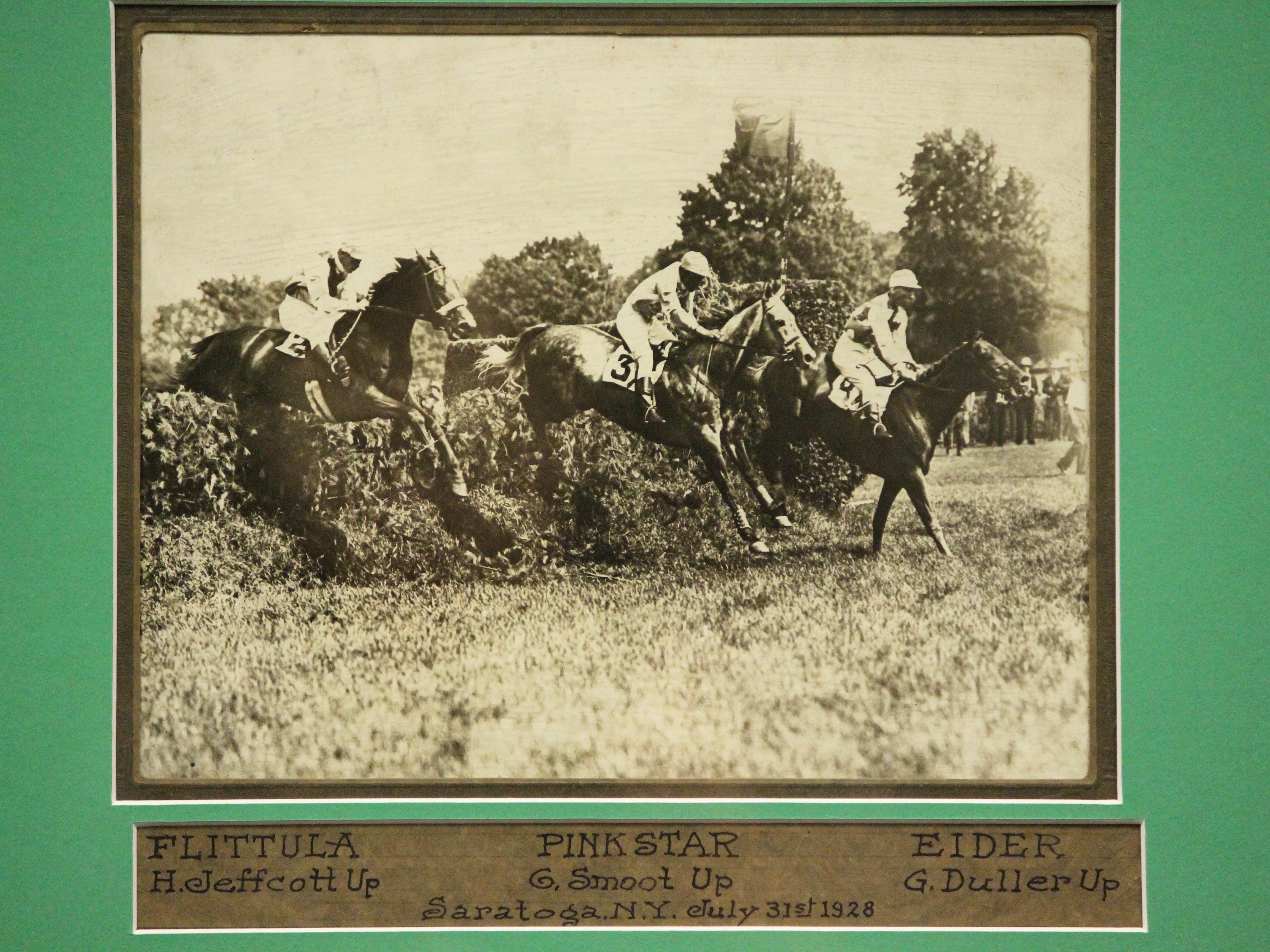 Classic B&W photo of three steeplechase horses & their jockeys clearing a brush fence at Saratoga Springs, NY racetrack from July 31st 1928

Photo Sz: 9