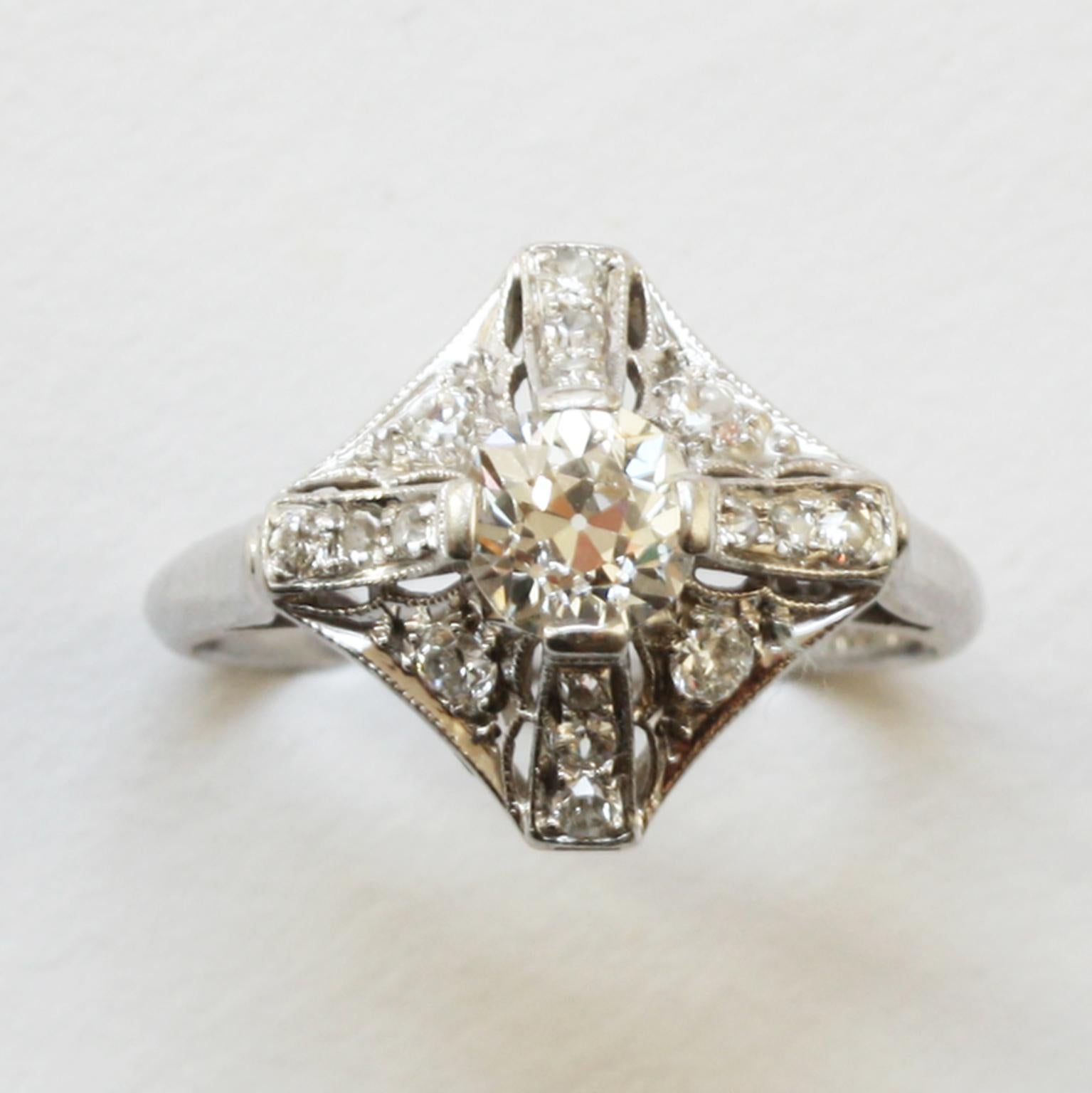 A platinum and diamond Art Deco ring set with old cut diamonds (app. 0.9 carats), signed: Peacock, for C.D. Peacock from Chigaco, American, circa 1920.

ring size: 16- mm. 5 ¼ US.
weight: 3.61 gram