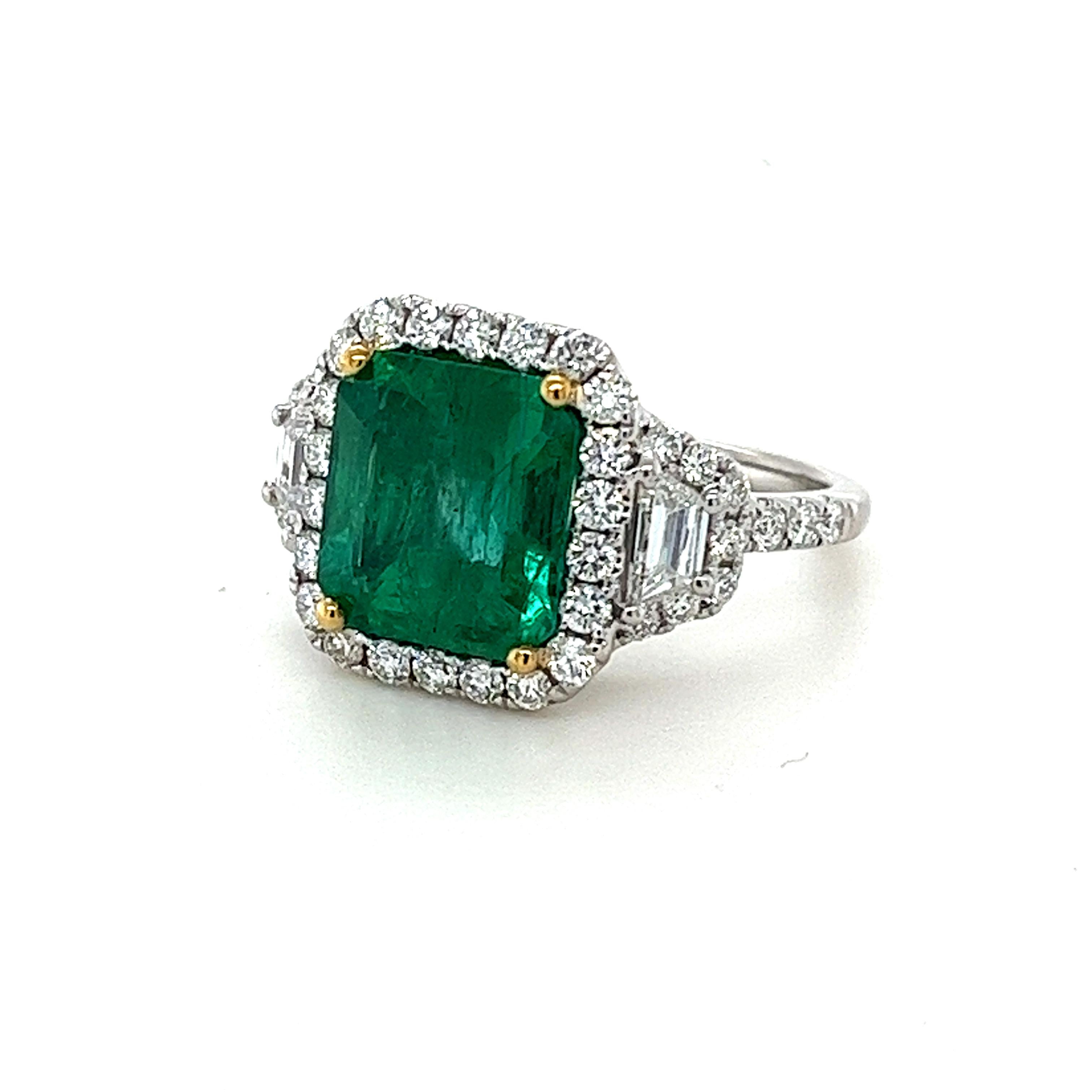 CDC certified Emerald Cut Emerald weighing 3.80 carats
Measuring (10.25x9.65x6.15) mm
Diamond quality is GH-Si
Round diamonds weighing .86 carats
Trapezoid diamonds weighing .36 carats
Set in 18 karat white gold ring
7.80 grams
