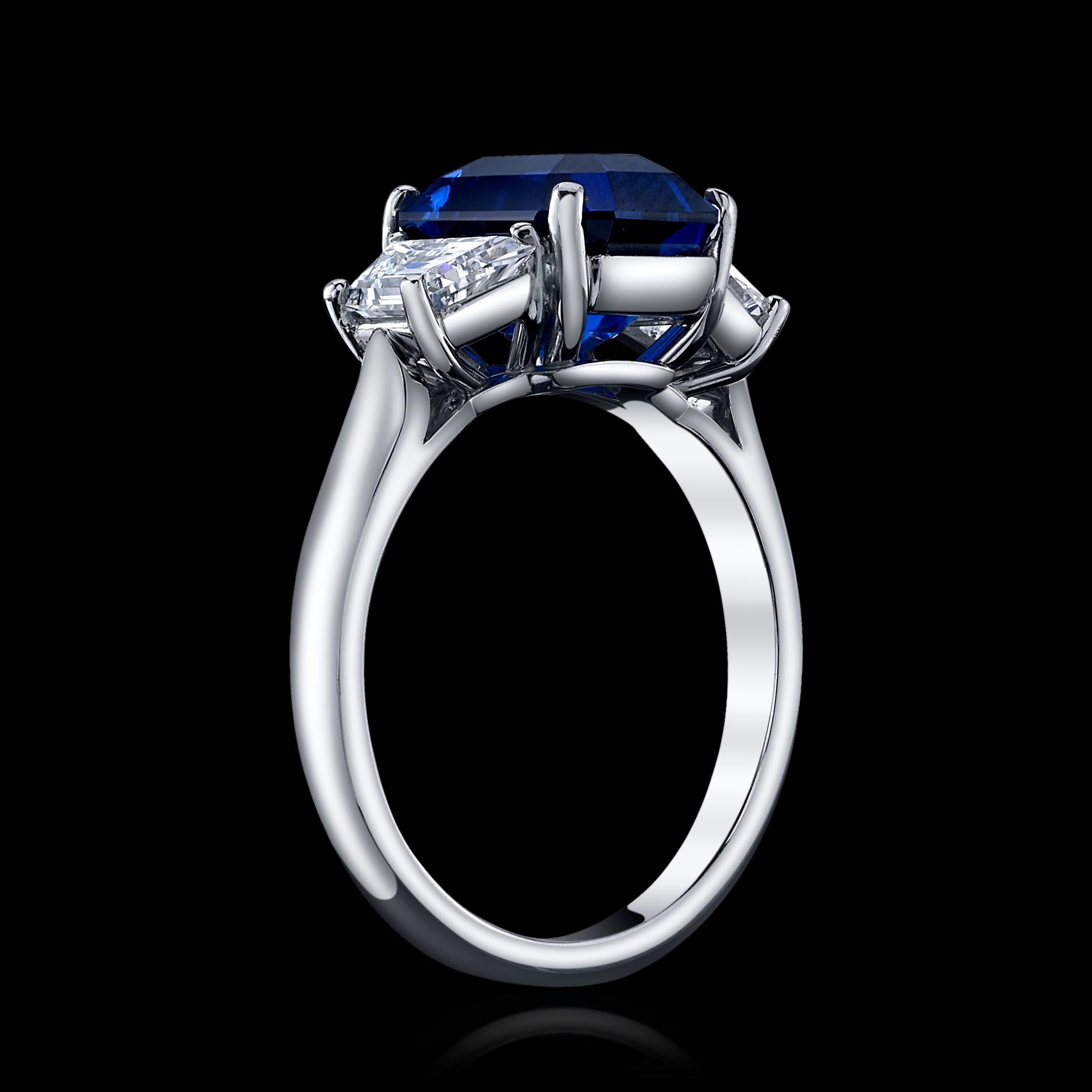 4.70ct Radiant Blue Sapphire set in platinum with 2 side trapezoid diamonds = 0.73cttw
CDC #1911271
