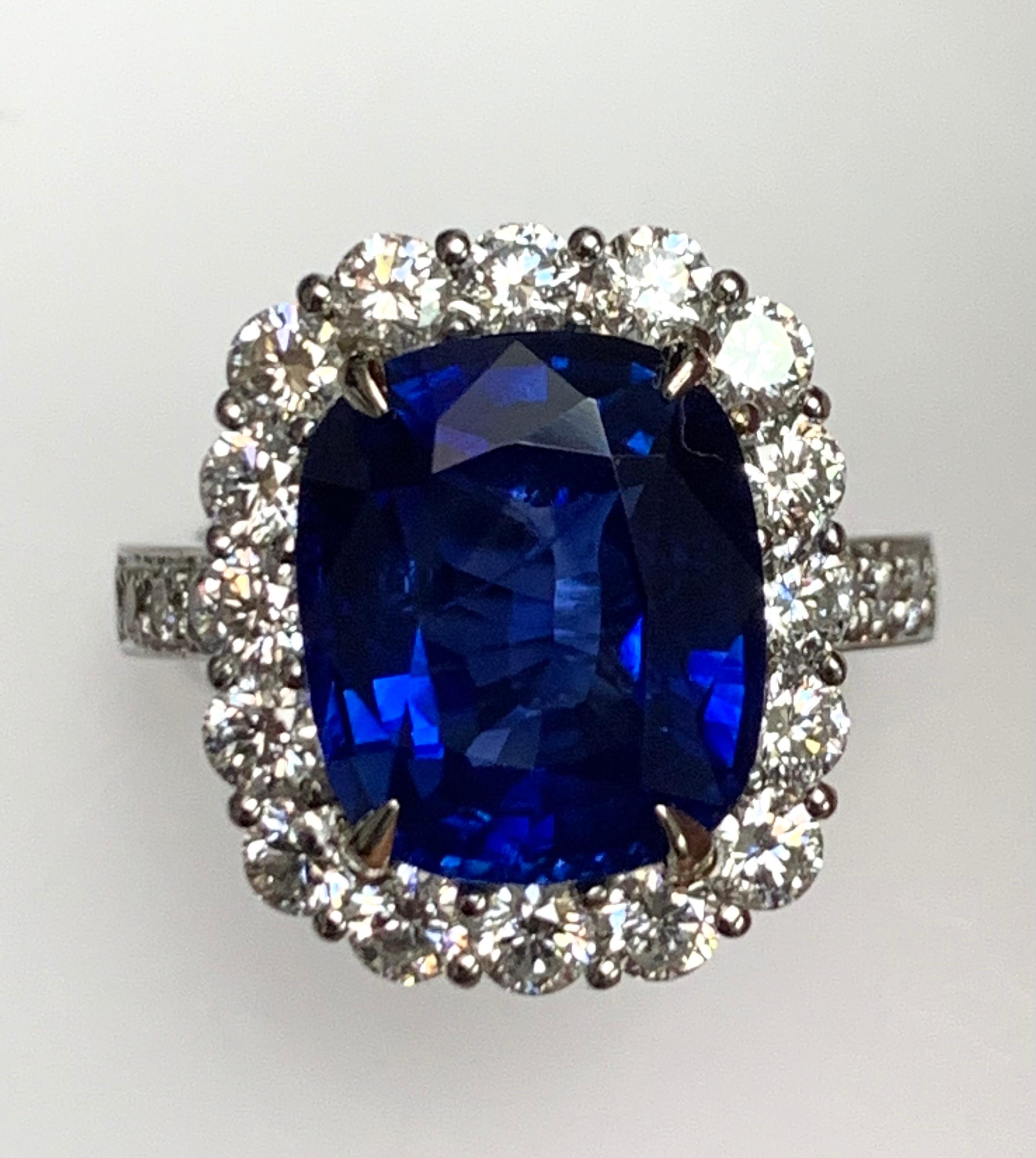7.59 Carat cushion shape Blue sapphire , Sri lanaka , heat , Certified by CDC lab , set in platinum ring surronded with 1.57 ct diamonds around and half way on the shank .