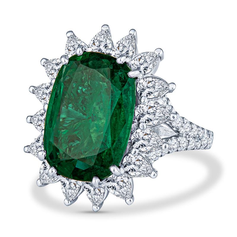 This phenomenal ring features a show stopping 9.11 carat cushion cut Zambian natural emerald accented by 3.00 carat total weight in natural pear shape and round diamonds set in 18 karat white & yellow gold. It is a size 6 but can be resized upon
