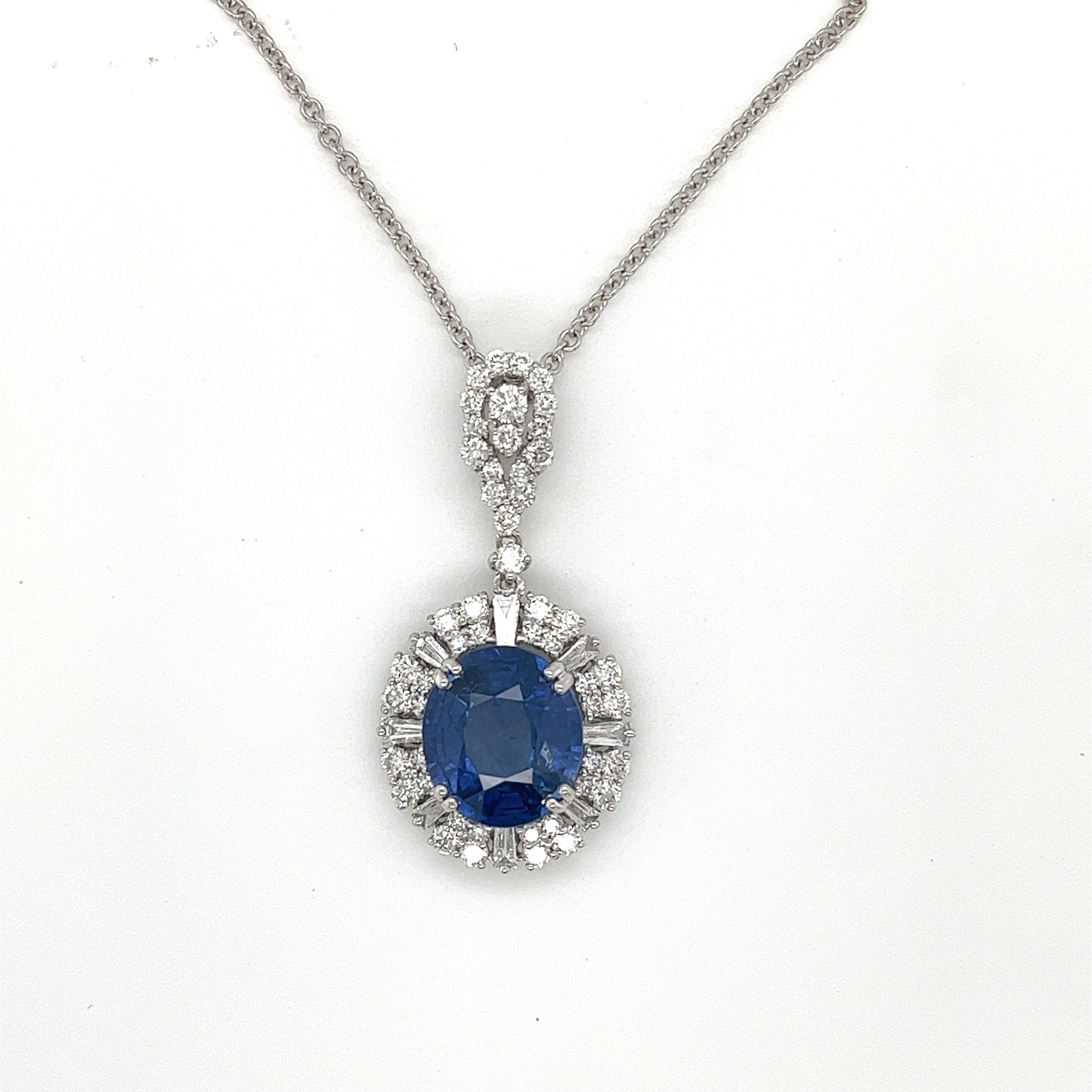 Oval Ceylon Sapphire weighing 5.48 cts
Measuring (11.60x10.30x5.58) mm
50 round diamonds weighing 1.11 cts
8 baguette diamonds weighing .25 cts
H SI1
Set in 18k white gold pendant
3.09 g
White gold chain is adjustable 16-18 inches
