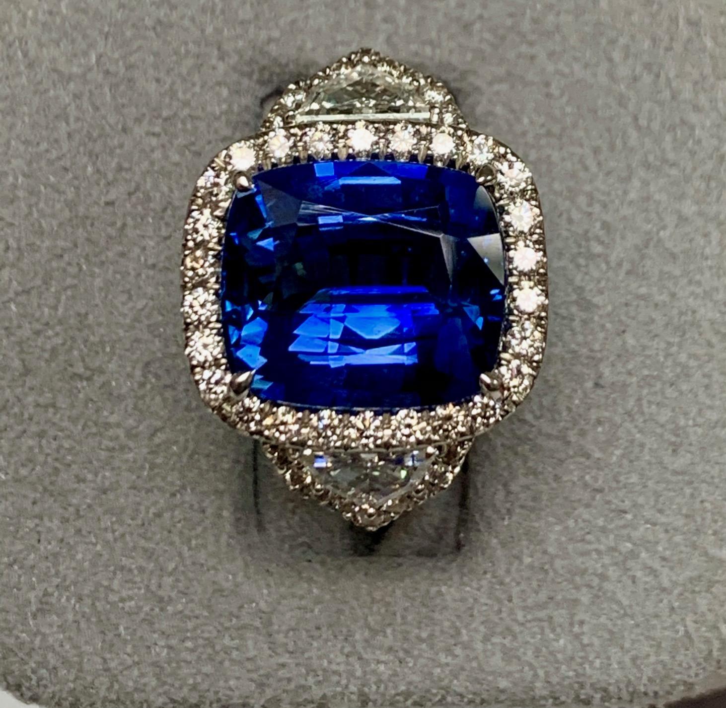8.42 Carat Cushion sapphire set in 18k white gold surronded with 0.70 ct round G-h color diamonds , vs1-si1 quality and 0.54 carat Epaulette cut white diamonds on the sides .