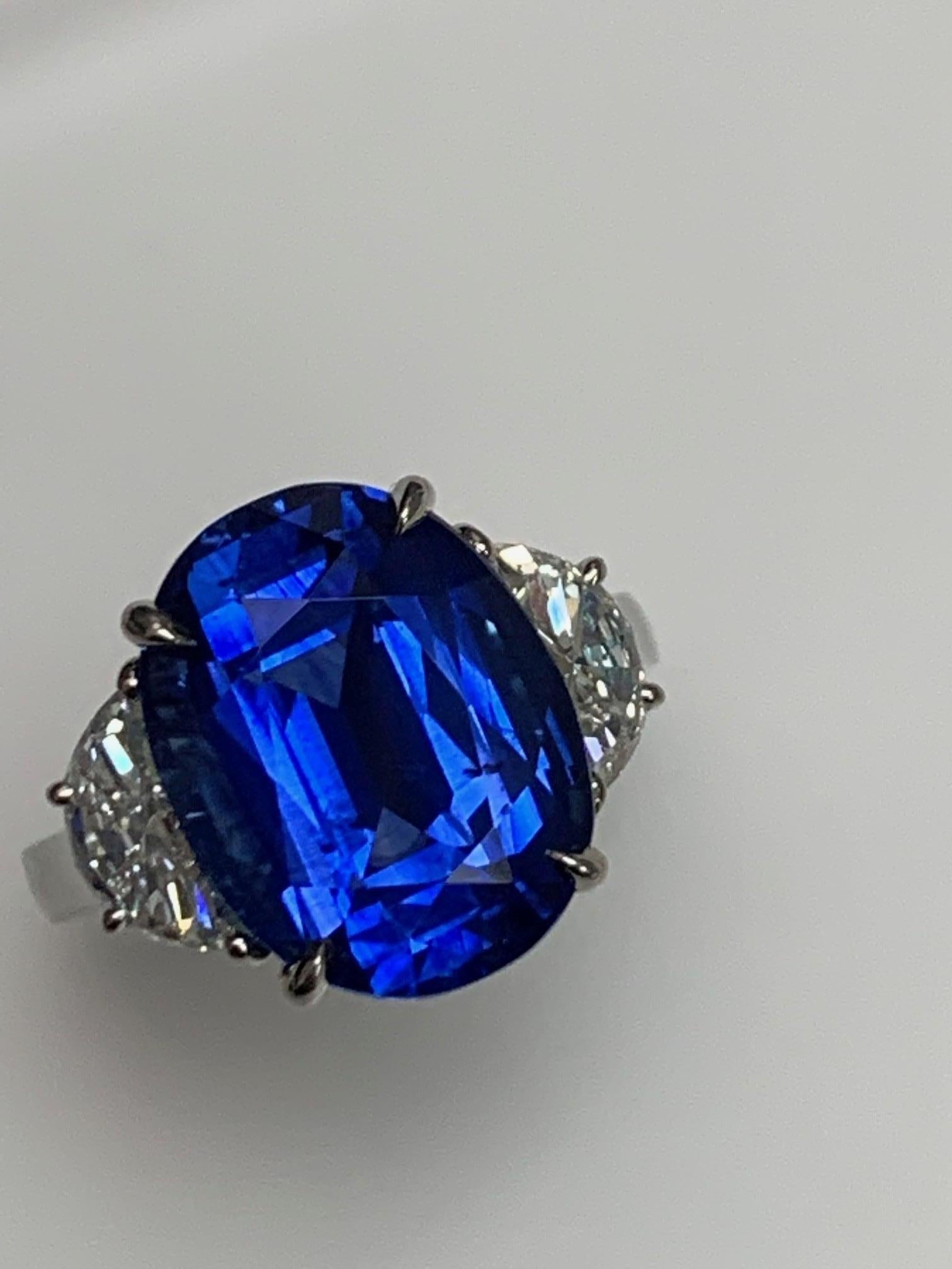 9.53 Carat Oval shape  Sri lanka Blue sapphire , heat, set in classic hand made three stone ring with 1.20 ct Half moon Diamonds , G , VS2 .