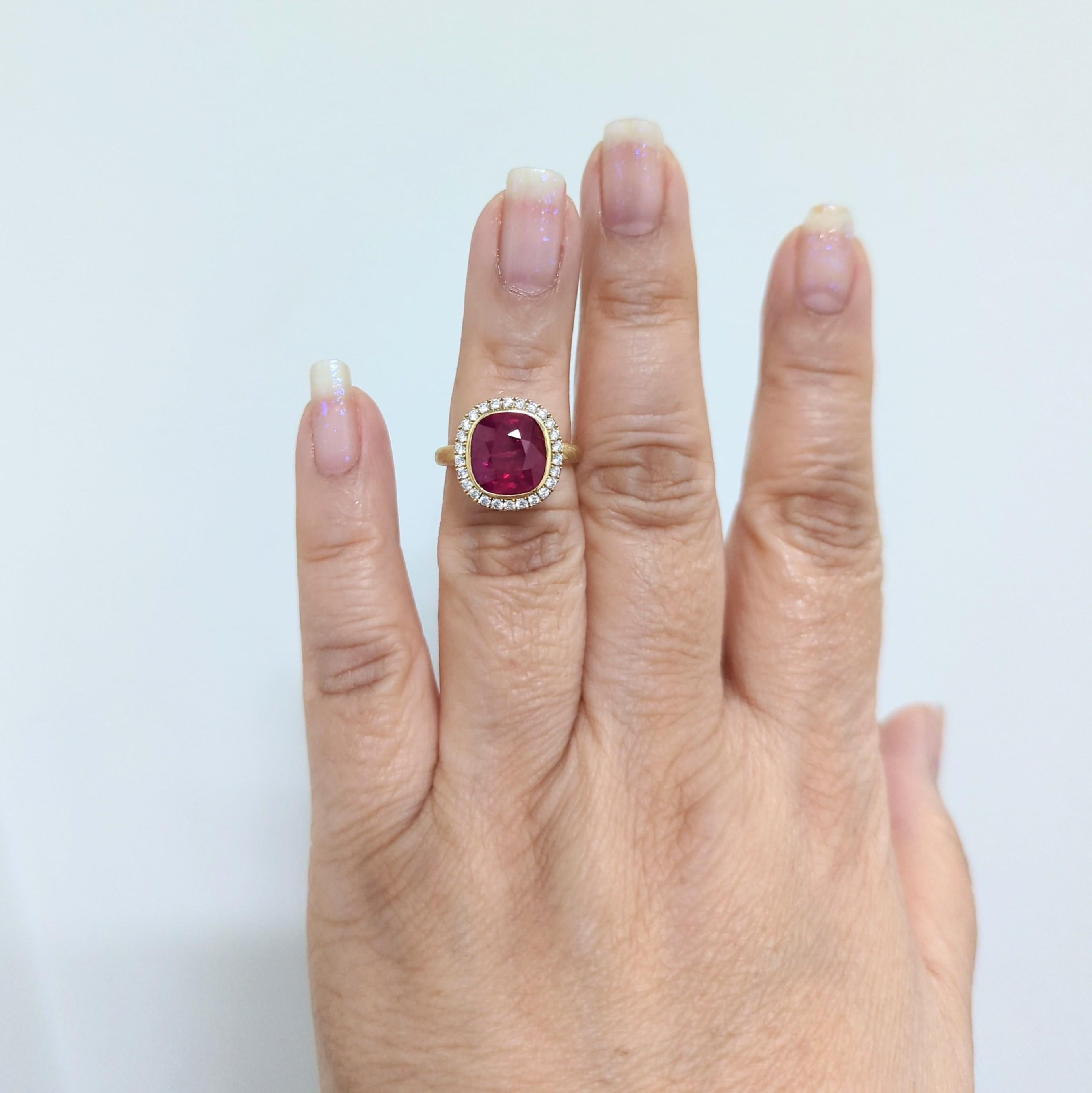 Gorgeous deep red 4.32 ct. Mozambique unheated ruby cushion with 0.42 ct. good quality white diamond rounds.  Handmade in 18k yellow gold.  Ring size 6.5.  CDC certificate included.