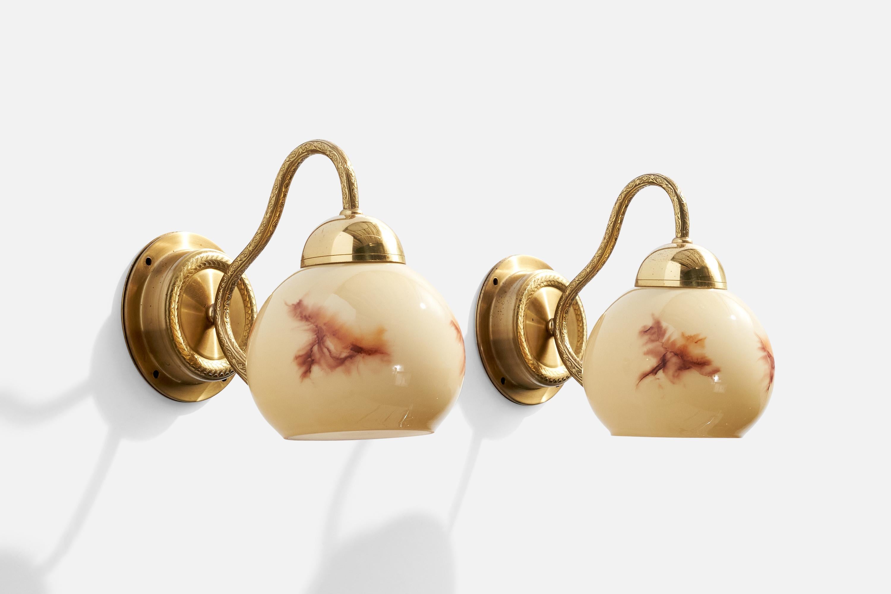 A pair of brass and glass wall lights designed by C.E. Fors and produced by EWÅ Värnamo, Sweden, c. 1970s.

Overall Dimensions (inches):  7.5” H x  5” W x  8“ D

Back Plate Dimensions (Inches):  4.125” H x 4.125” W x 1.25” D

Bulb Specifications: