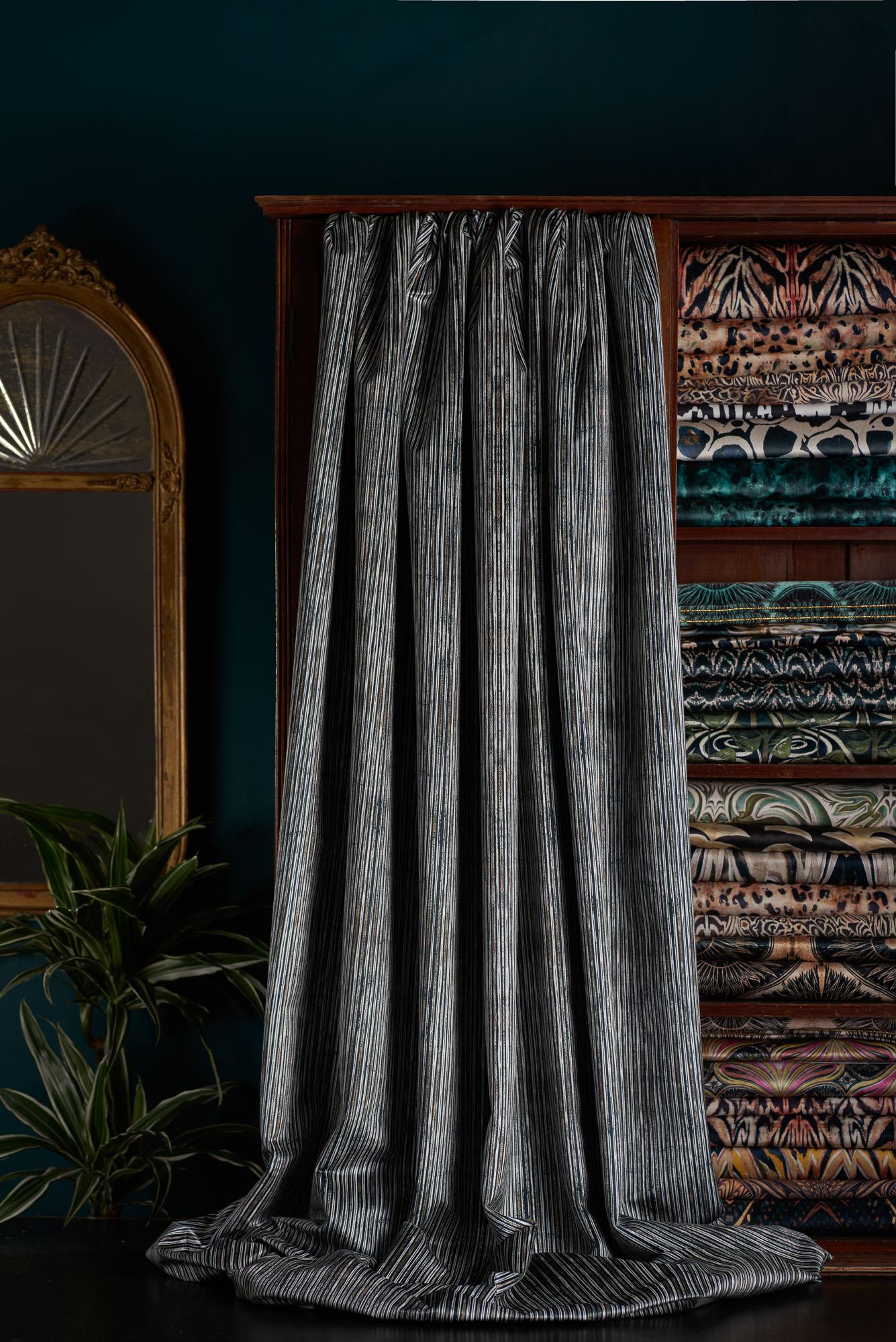 Our simple stripe for neutral lovers – a black white and gold striped pattern on our luxury slight shine velvet. 

This velvet is midweight, with a strong straight woven backing, so is suitable for upholstery, but is also light enough for curtains