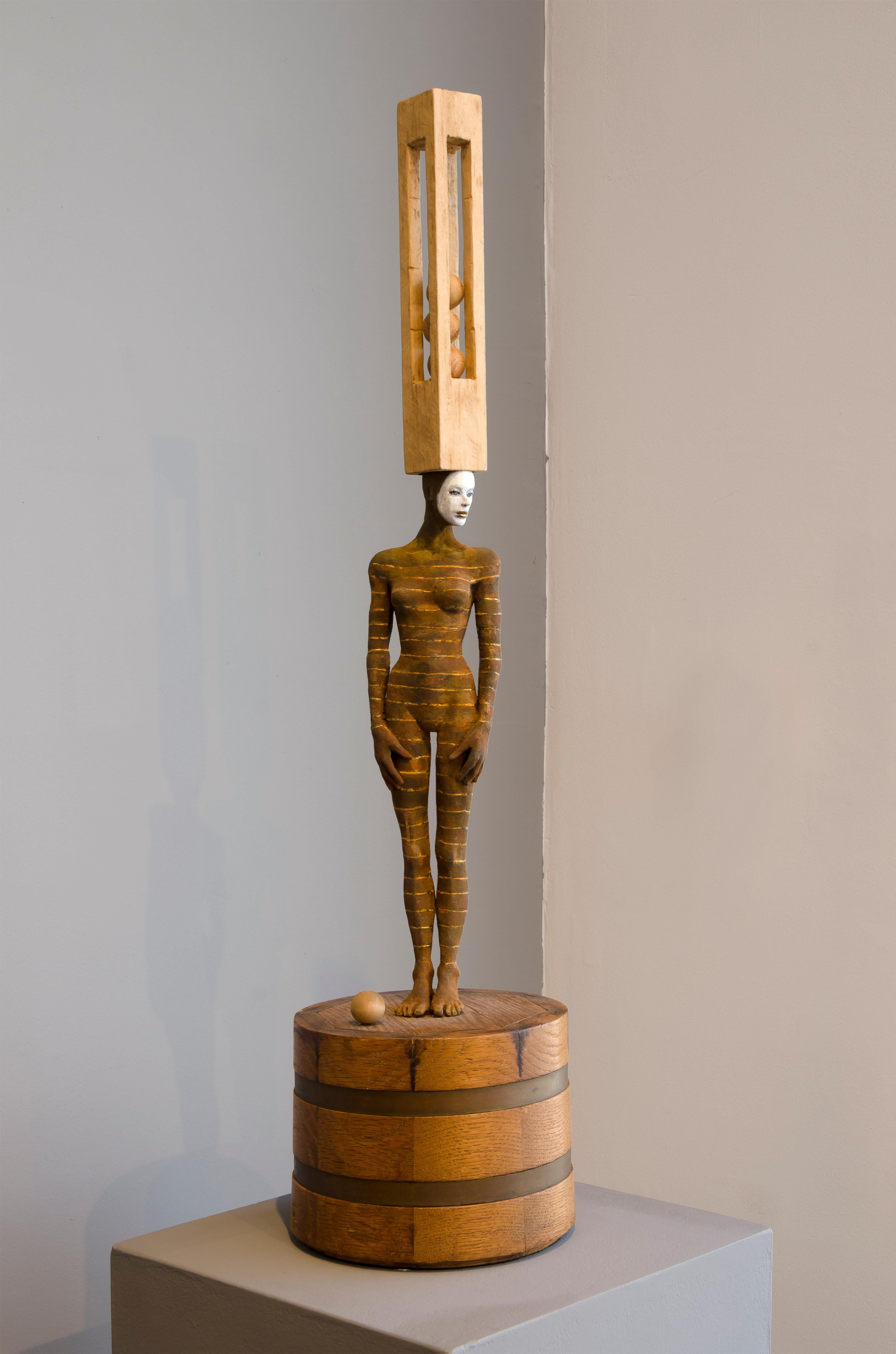 Cecilia Z. Miguez Abstract Sculpture - Balancing Act, bronze and wood sculpture of female with head accessory
