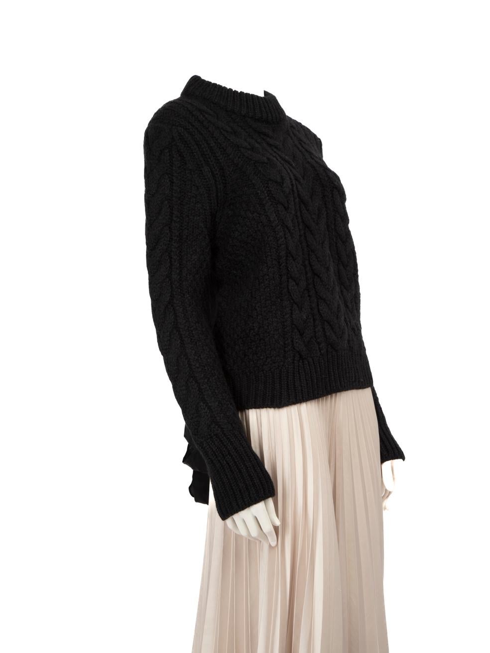 CONDITION is Very Good. Hardly any visible wear to knitwear is evident on this used Cecilie Bahnsen designer resale item.



Details


Black

Wool

Knit jumper

Long sleeves

Round neck

Back tie straps





Made in Romania



Composition

70% Wool,
