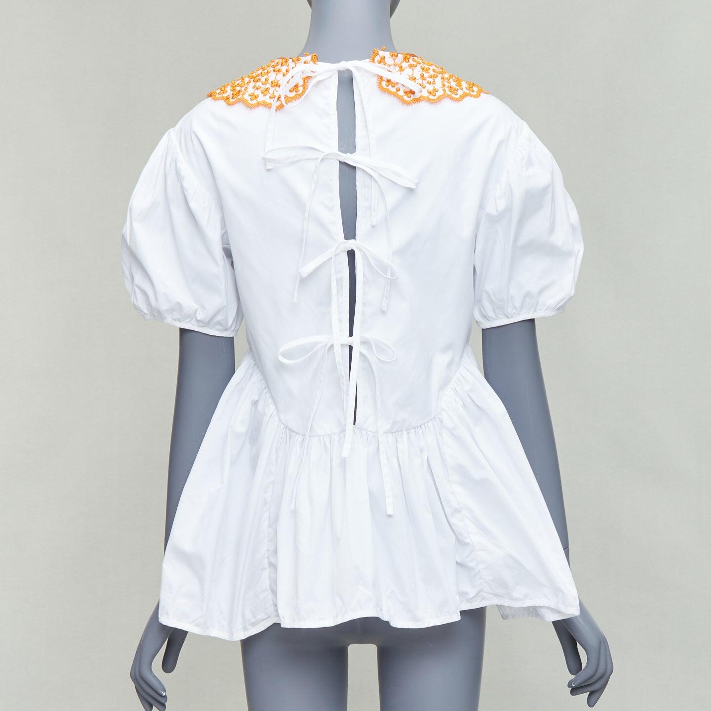 CECILIE BAHNSEN Mie white cotton orange applique collar puff top UK6 XS
Reference: KYCG/A00086
Brand: Cecilie Bahnsen
Model: Mie
Material: Cotton
Color: White, Orange
Pattern: Solid
Closure: Self Tie
Extra Details: Cecilie Bahnsen‚Äôs romantic