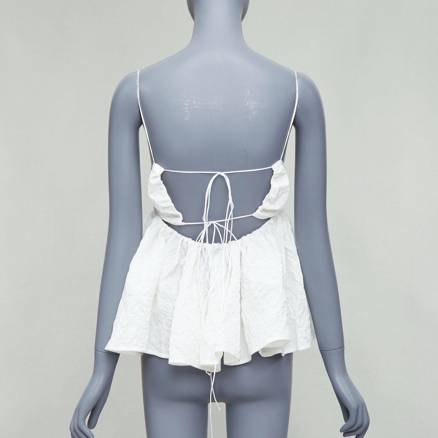 CECILIE BAHNSEN Sunni white cloque cotton babydoll top UK10 M
Reference: ECLO/A00029
Brand: Cecilie Bahnsen
Model: Sunni
Material: Cotton, Blend
Color: White
Pattern: Floral
Closure: Self Tie
Extra Details: Self tie back.
Made in: