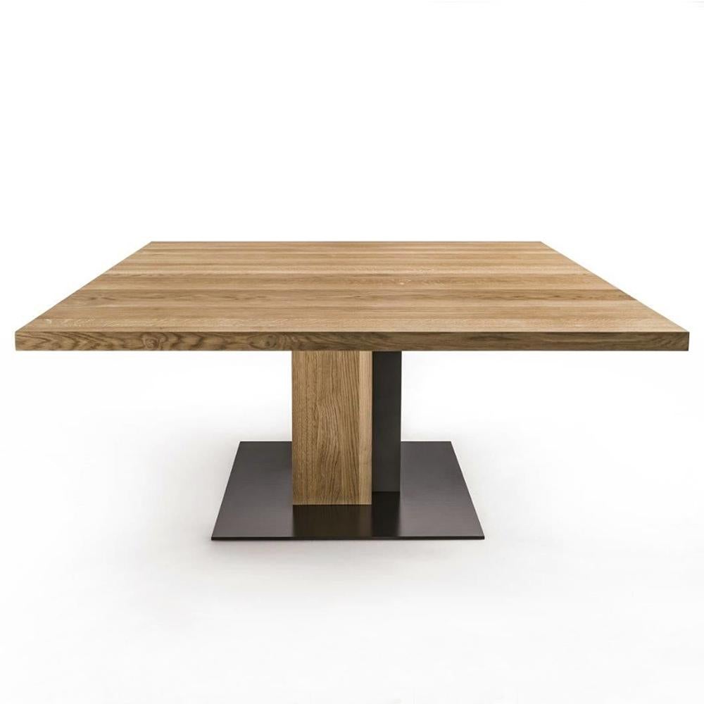 Dining Table oak and iron square in solid natural 
oak wood and with lacquered iron.
Base made in on block of oak wood and made with
lacquered iron. Oak treated with natural pine extracts
wax. Elegant and original piece. 
Also available in solid