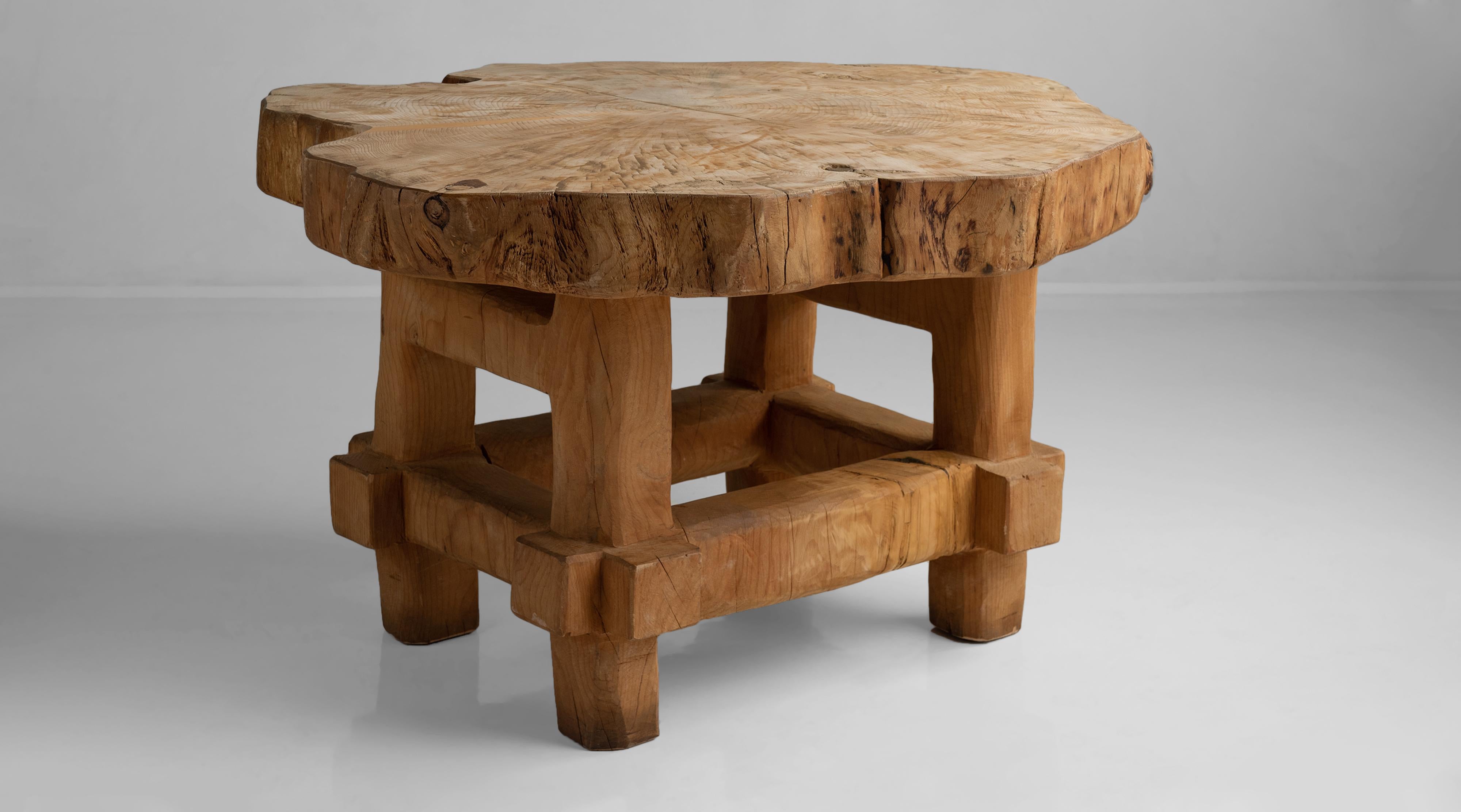 Cedar trunk table, England, circa 1950.

Cedar slab top with legs and stretcher cut from a single piece of wood.