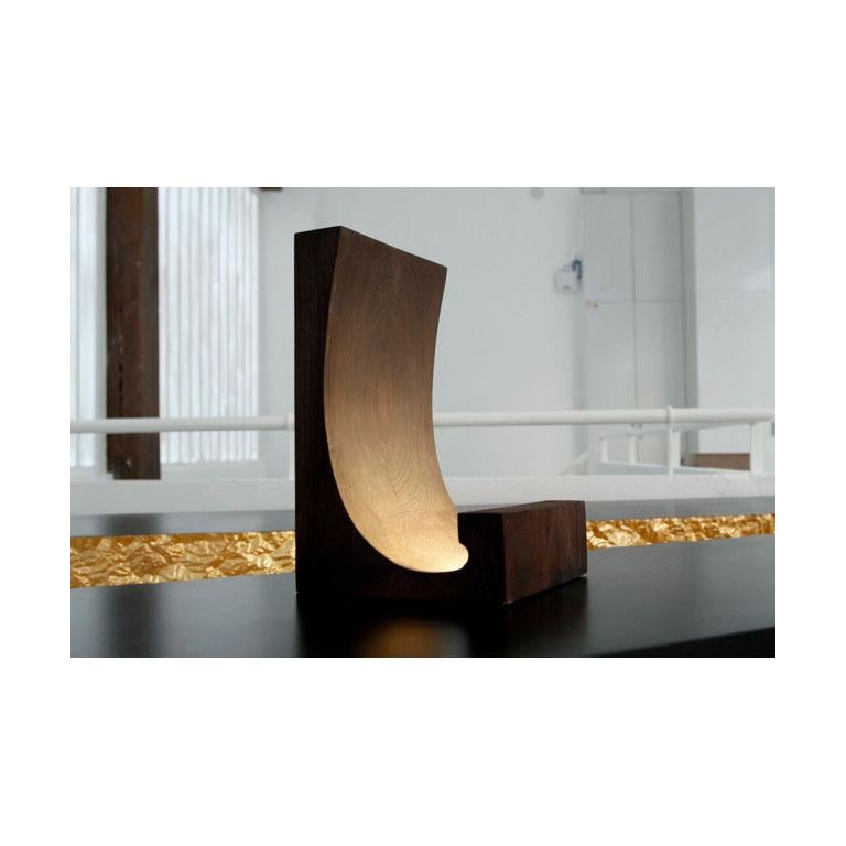 “A pure line, a movement, a breath, a comma. . . the essential. ” Thierry Dreyfus. The light slides over this elegant form thanks to hidden LED which is reflected in cedar wood, marble, alabaster, onyx or brass. . . A different light provided by the