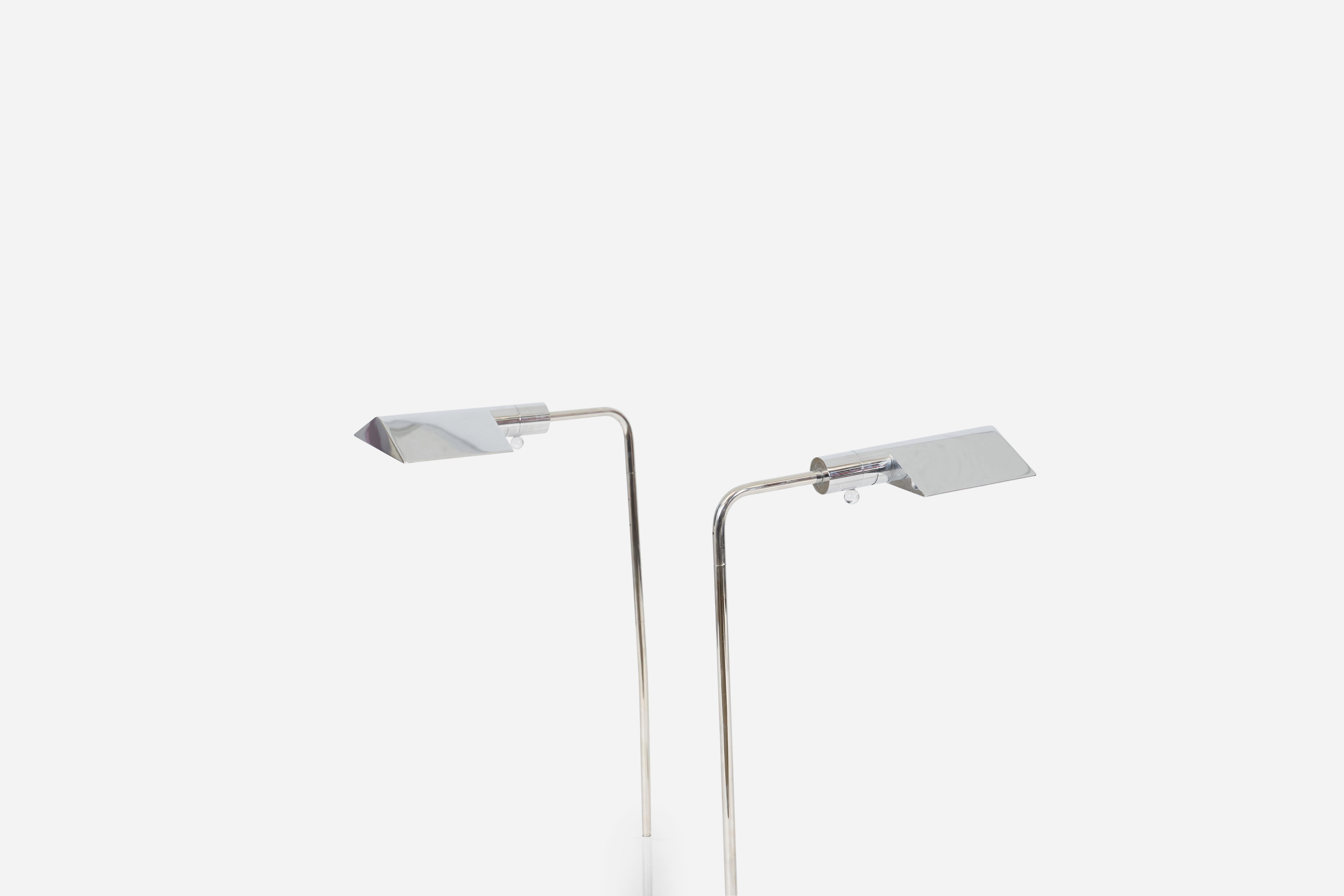 Pair of stainless steel floor lamps by Cedric Hartman. Lamps are fully adjustable in height and shade direction. Signed to underside 