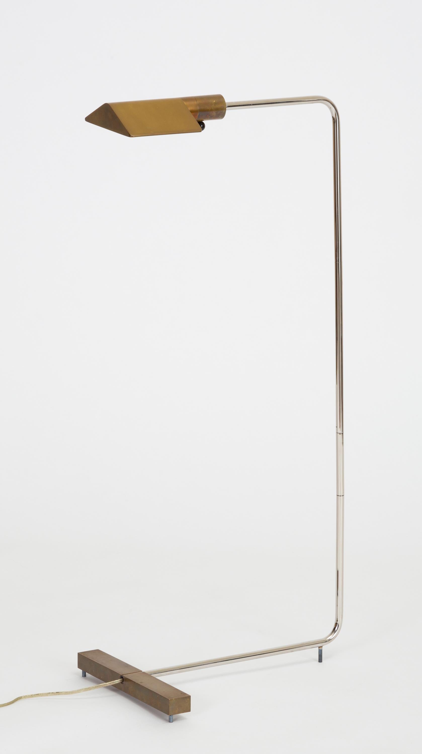 Designed in 1966, the 1UWV floor lamp by Cedric Hartman is an enduring design classic. A modernist take on the pharmacy lamp, the 1UWV has a triangular brass shade on a swiveling arm that offers focused task lighting. The cantilevered chrome pole