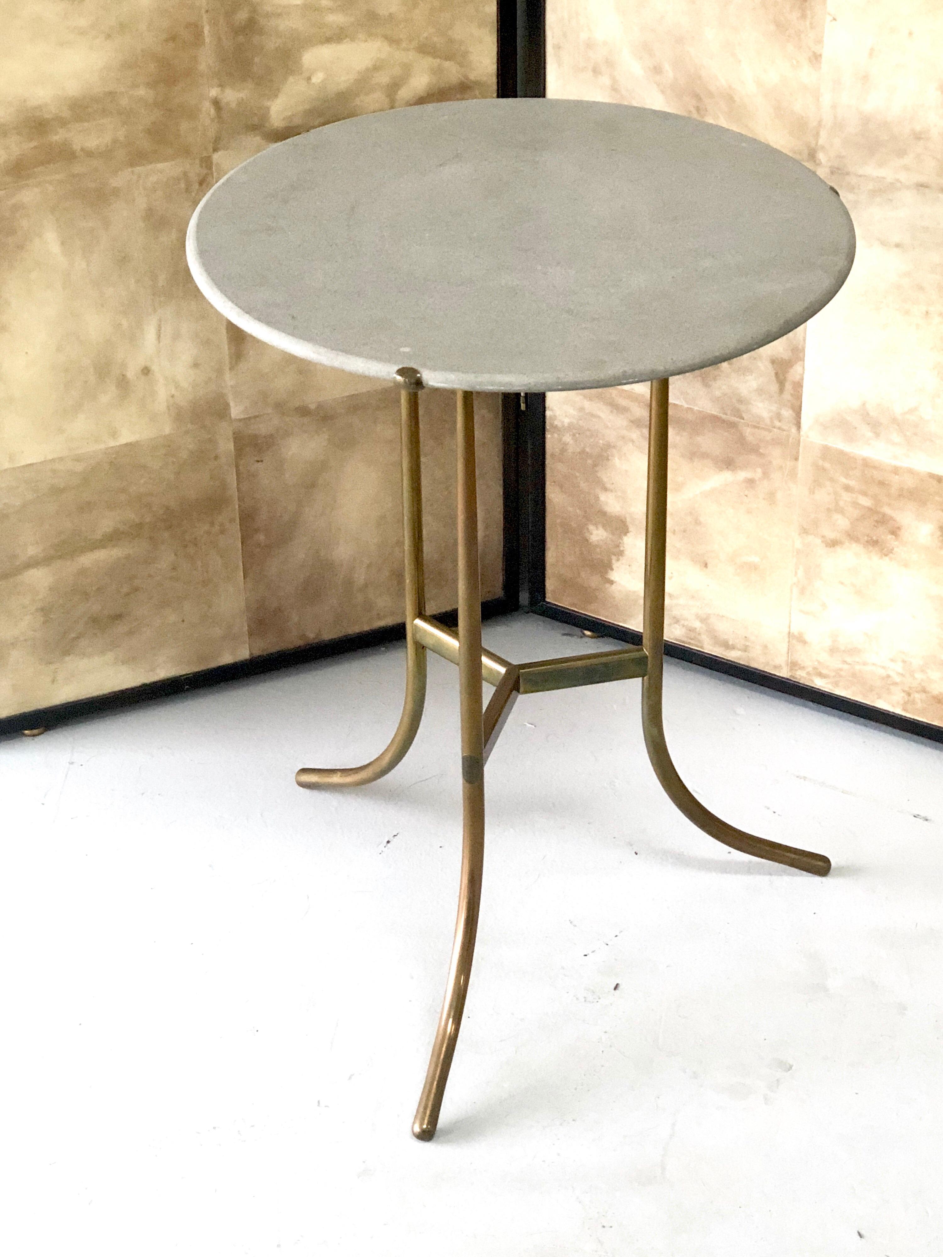 Very practical and iconic side table. The solid bronze frame with a honey granite top. Signed and number on verso.