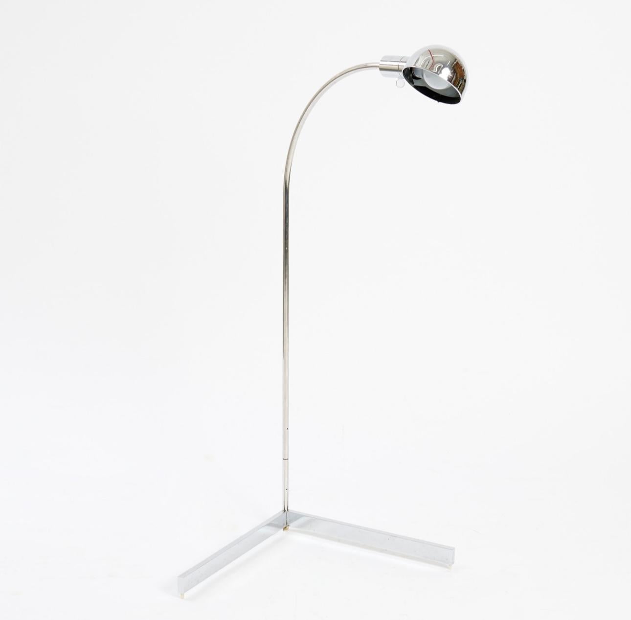 A rare and early floor lamp by Cedric Hartman, Model #22H, featuring a curved arm and V-shaped base. This model is out of production.

Crafted of polished chrome with signature spherical Lucite on/off switch.  

Stamped with maker's mark on