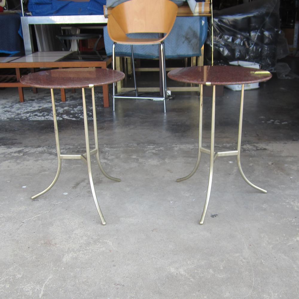 A pair of side tables made and designed by Cedric Hartman. These tables feature a new granite top with a beveled edge and a frame of stainless steel. Under the tabletop, on the metal are etched inscriptions including a Made in America, the designers