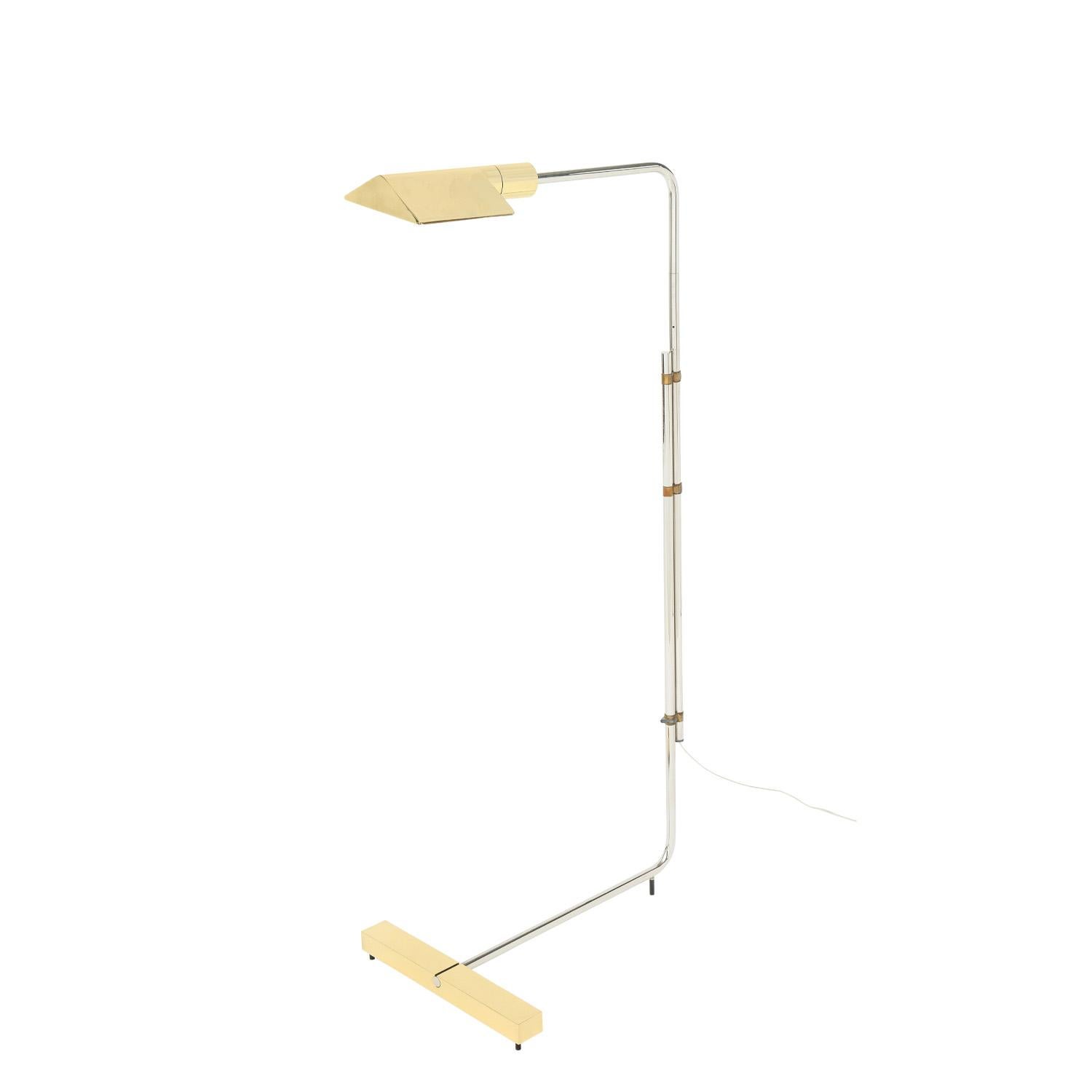 Iconic reading lamp in polished chrome and brass with lucite light switch by Cedric Hartman, American 1980's (signed on bottom “Cedric Hartman”). This lamp has been completely restored - professionally cleaned, polished and rewired.

Height as
