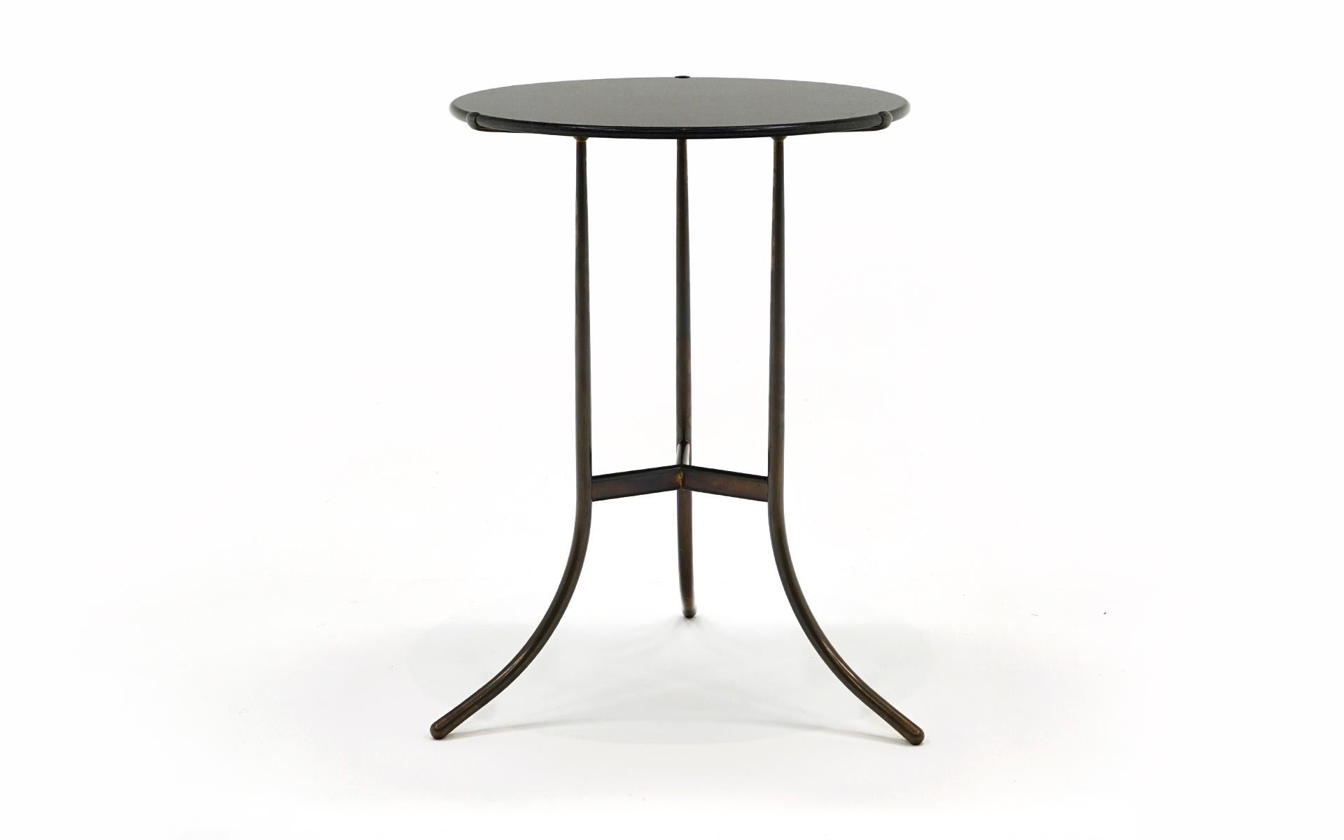 Cedric Harman end table.  Dark grey / charcoal / almost black round marble top with brass frame.  The brass has a beautiful even patina presenting in a soft luster.  The frame could be polished to a shiny finish at the customers request but we