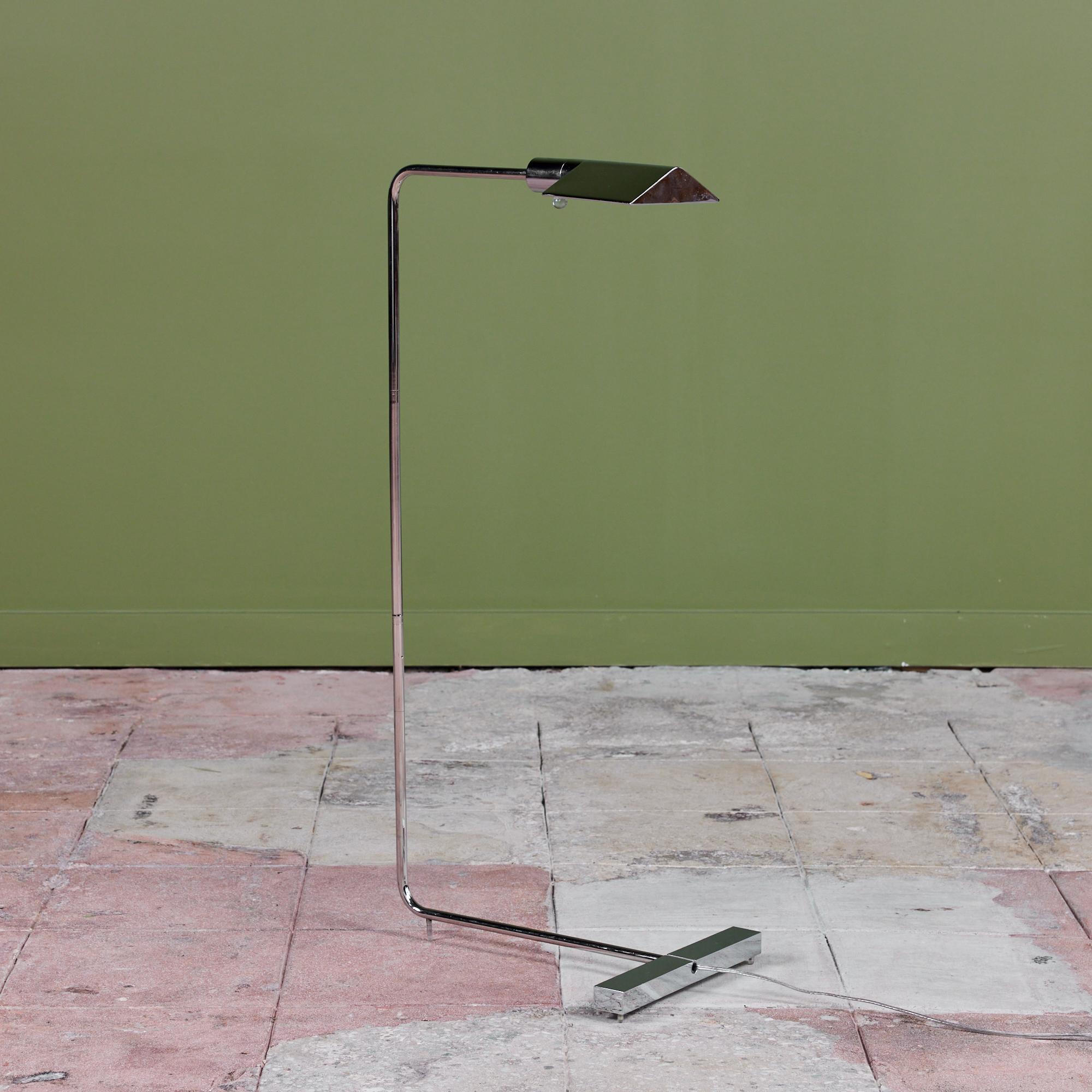 Designed in the 1970s, this stainless steel floor lamp by Cedric Hartman is an enduring design classic. The modernist floor lamp features a triangular stainless steel shade attached to a curved stainless steel stem that offer focused task lighting.