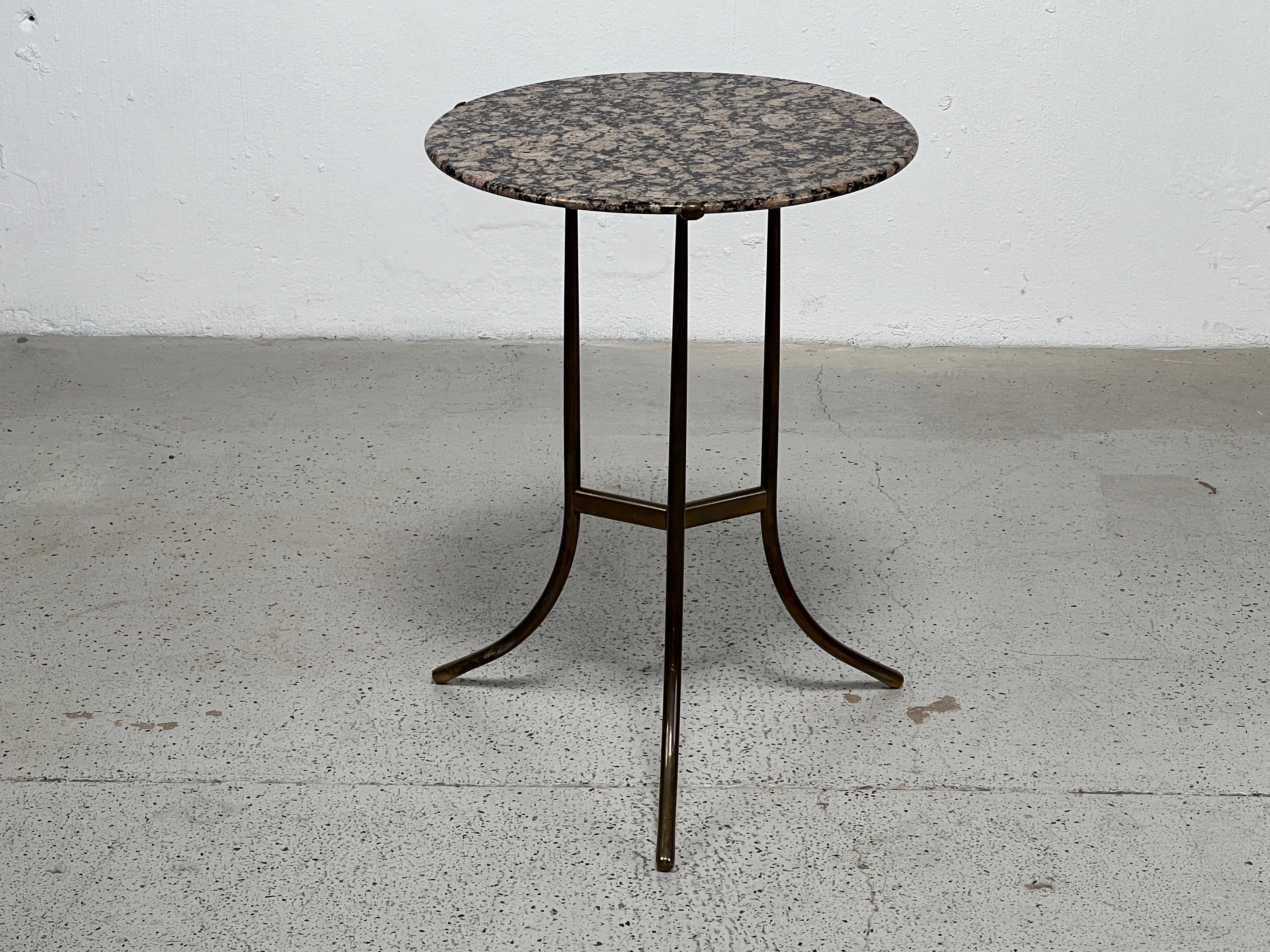 A bronze side table with Rosso granite top designed by Cedric Hartman.