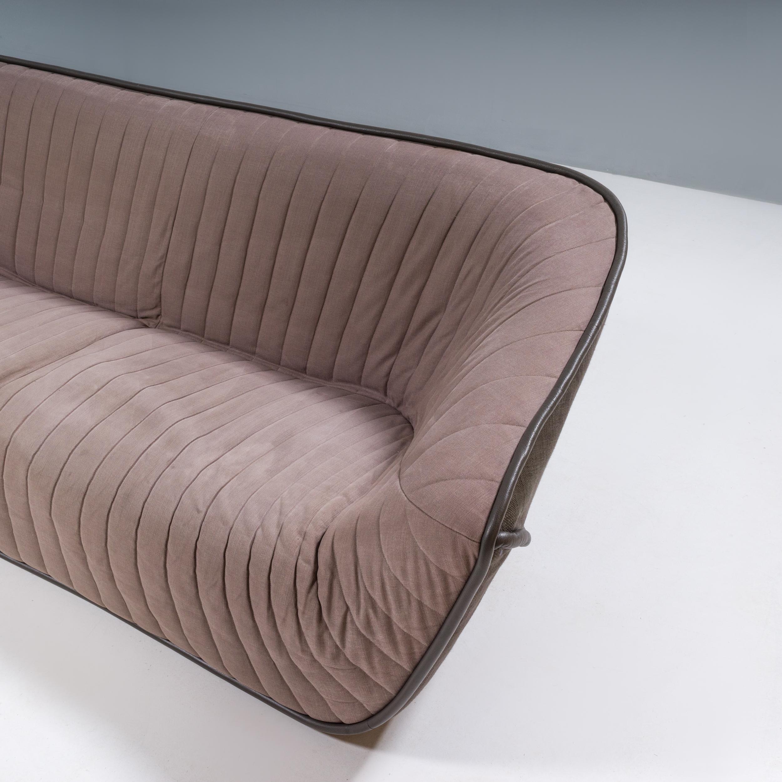 Originally designed by Cédric Ragot for Roche Bobois in 2013, the Nautil sofa gives a contemporary update to the iconic styles of the 1970s.

Constructed from a solid wood frame, the sofa has foam padding creating the enveloping shell-like