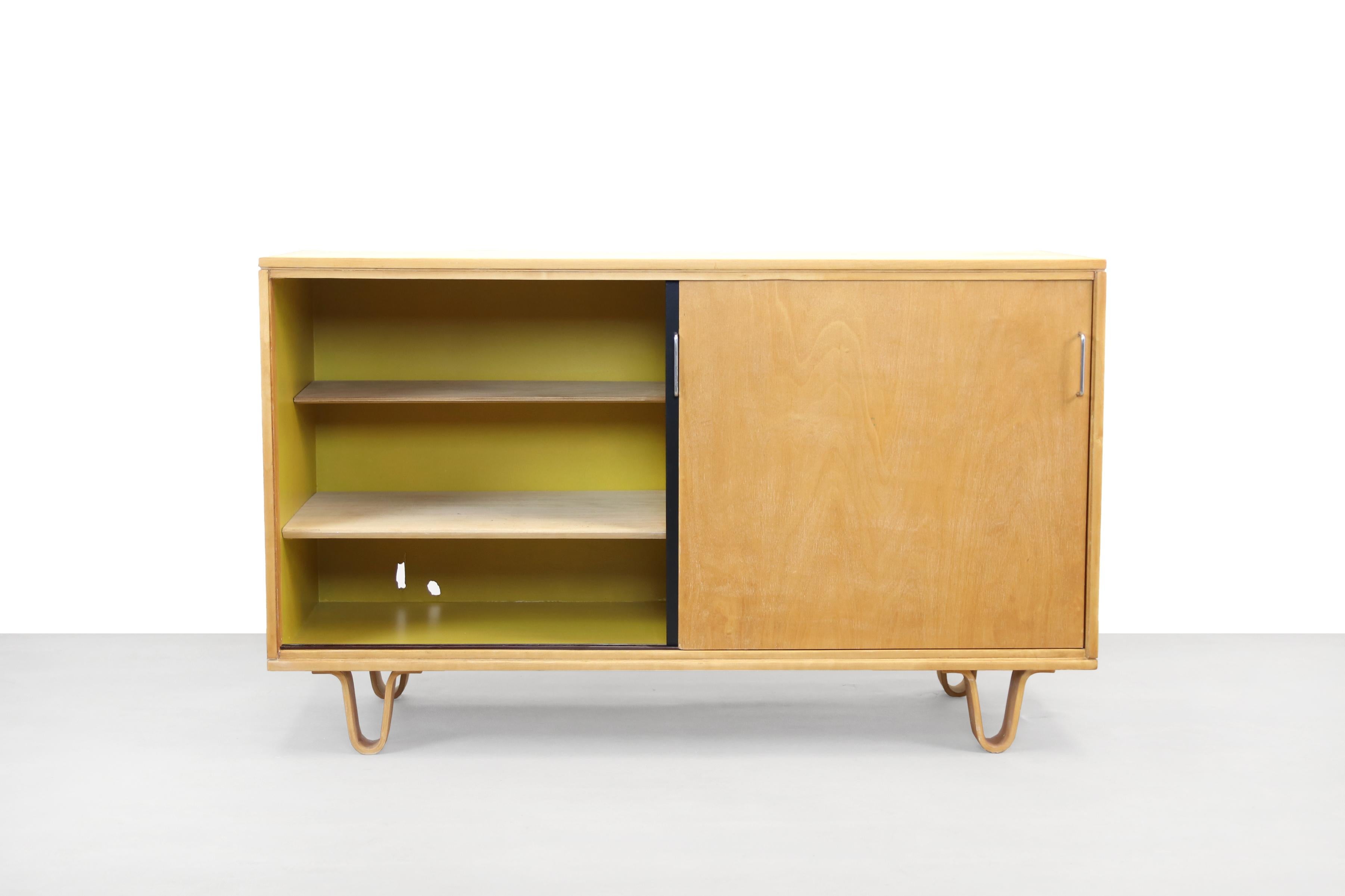 Beautiful, uncommon sideboard from the Birch series by Cees Braakman for Pastoe. The sideboard has 2 sliding doors, one of which is painted black, and is made entirely of birch wood. The famous plywood bentwood legs are iconic to this line. The