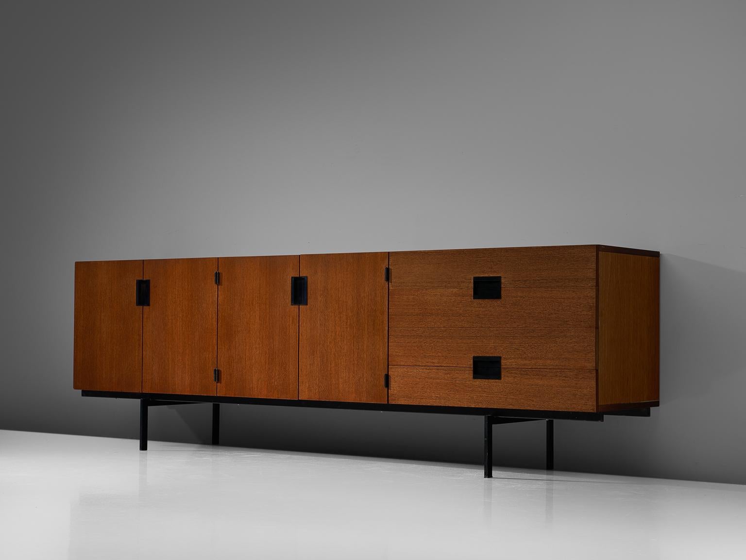 Cees Braakman for UMS Pastoe, sideboard model DU03, teak and metal, by The Netherlands, design 1958, production 1960s

Elegant and modest teak sideboard by Cees Braakman for UMS Pastoe. This sideboard consists of a small metal base, which creates